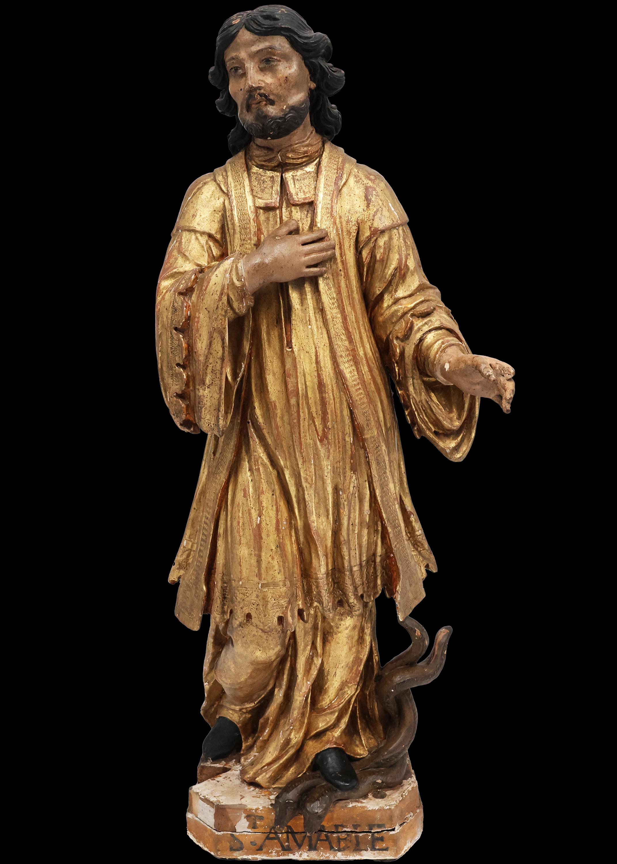 Beschreibung
Polychrome Holzskulptur mit der Darstellung des Heiligen Amable. Der heilige Amable von Riom war ein lateinischer Presbyter und gehörte zu den ersten Pfarrern von Rium. Die Überlieferung besagt, dass bei seiner Stimme Schlangen und