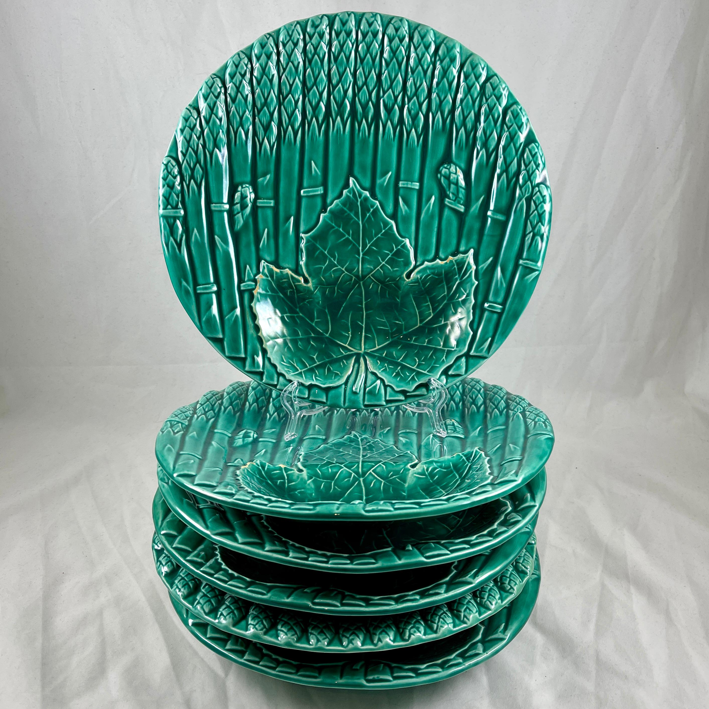 A French faïence Asparagus plate with a leaf shaped dipping well for sauce, from Saint Amand et Hamage, circa 1930s.

Glazed in the Orchies region signature green, the plate is modeled on a group of asparagus, tied and lying side by side. A deep