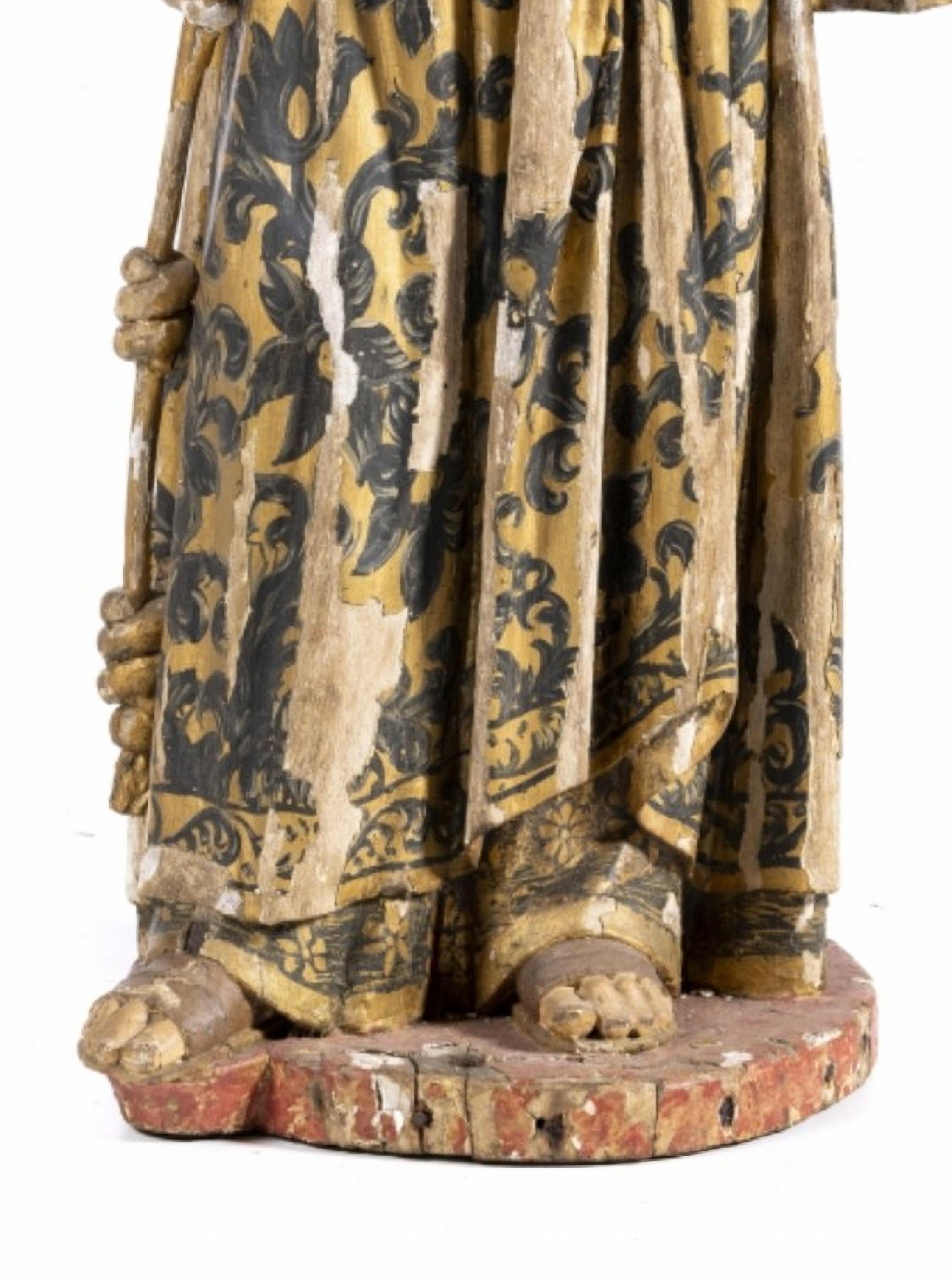 Saint Antony with Child Jesus, 18th century.

Portuguese sculpture in polychrome and gilded wood, from the 17th century.
The figure is represented standing, holding the book with his left hand. 
Missing and defects.
Dimensions: 92 x 42 cm.