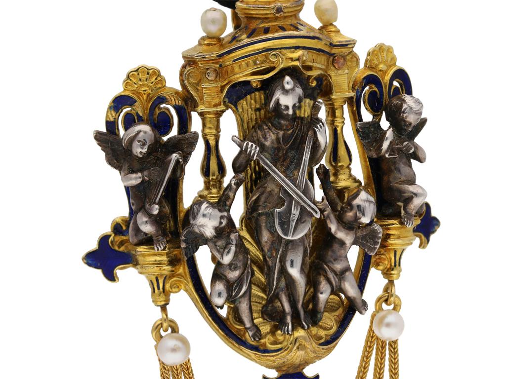 Saint Cecelia chatelaine pendant by Froment-Meurice. A gold and silver pendant in the Renaissance Revival style, the main element composed of an ornately carved openwork architectural structure in the form of an altarpiece, the central niche