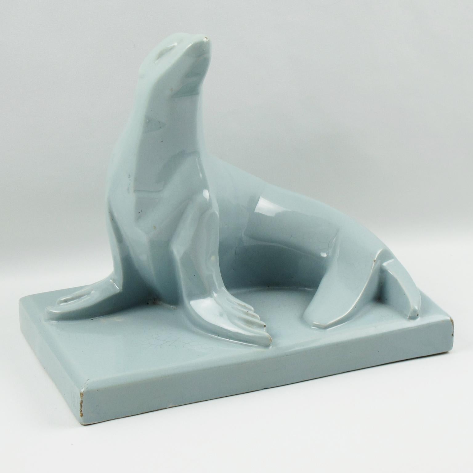 This stunning French Art Deco crackle-glazed cubist ceramic sculpture is extremely rare, both by the color and the model. This ceramic sculpture was designed and manufactured in Saint-Clement, France. The animal sculpture features a stylized seal