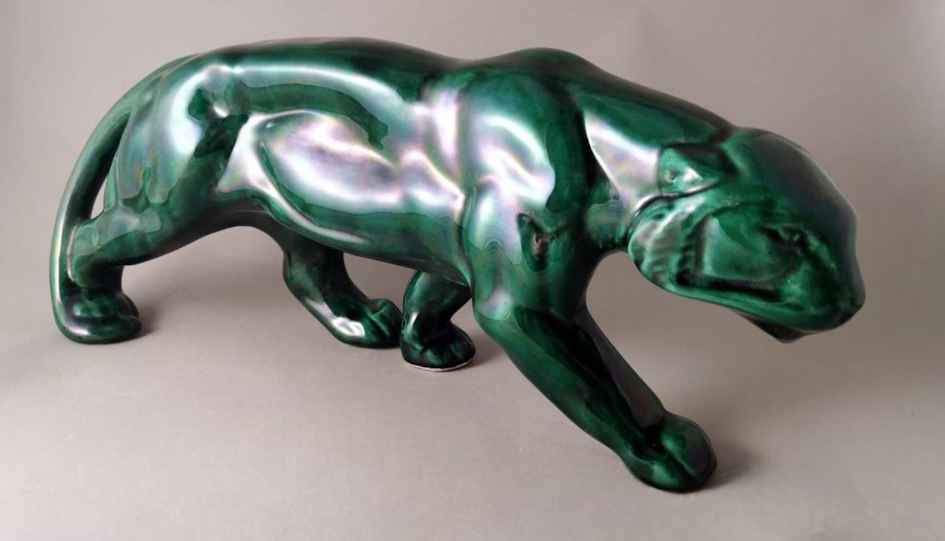 We kindly suggest that you read the entire description, as with it we try to give you detailed technical and historical information to guarantee the authenticity of our objects.
Spectacular and iconic green glazed ceramic panther in the Art Deco