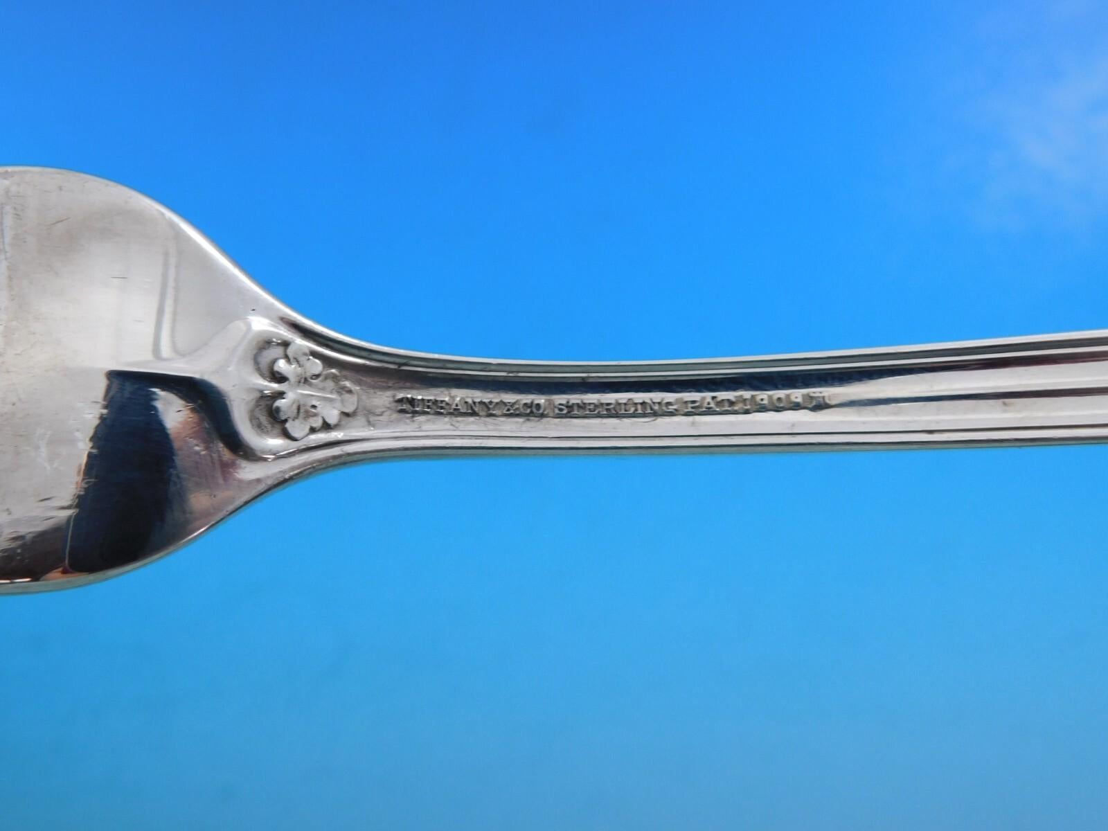 Exceptional Saint Dunstan by Tiffany and Co. sterling silver flatware set - 84 pieces. This pattern was introduced in the year 1909 and features a threaded edge handle with leaf accent detail in the corners. This set includes:

12 Dinner Knives,