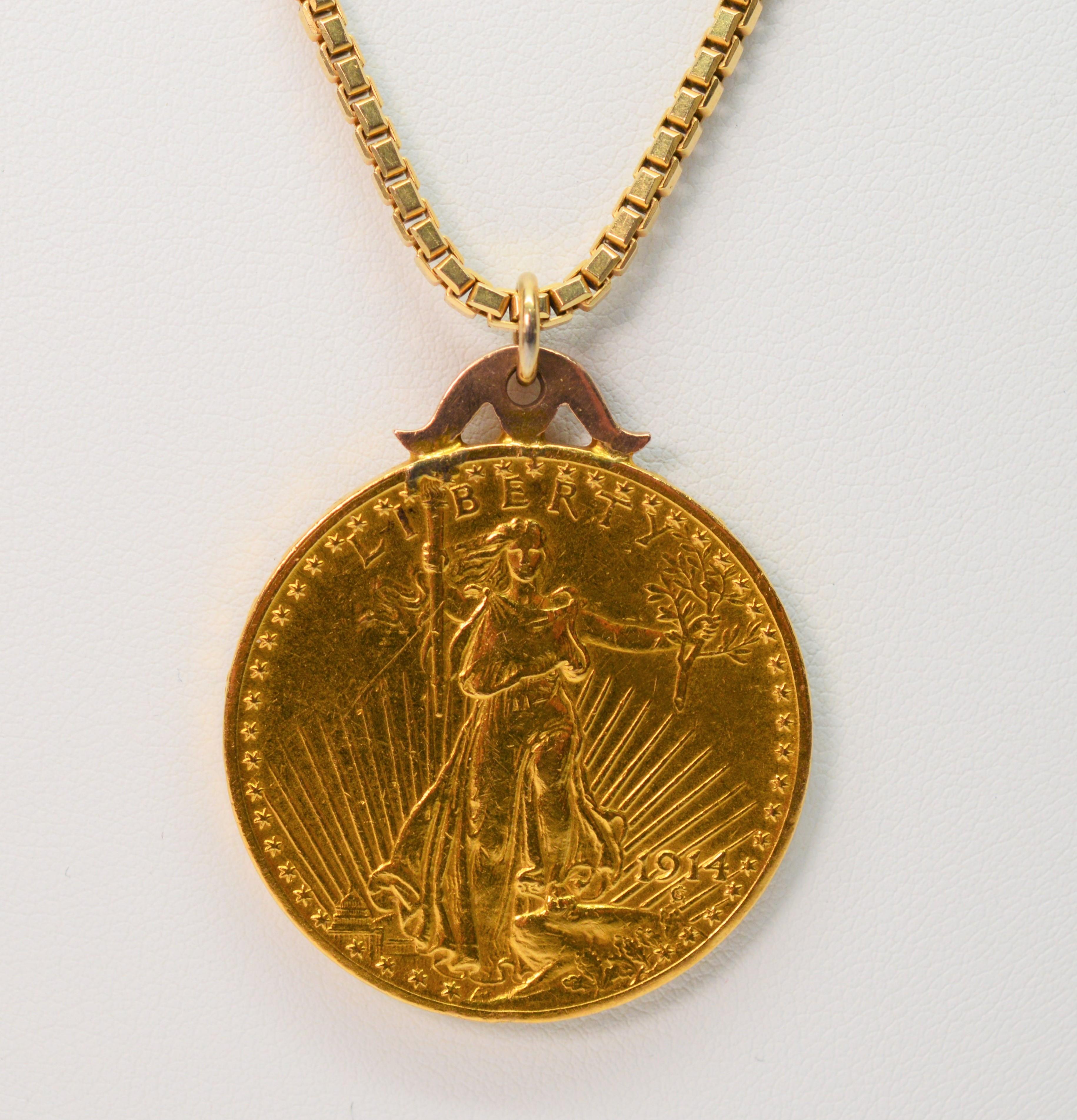 Make a bold statement in gold with this authentic genuine 1914 Saint Gauden twenty two karat 22k Gold Double Eagle Twenty Dollar American Coin pendant necklace . The twenty dollar gold piece designed by Augustus Saint-Gaudens and issued from