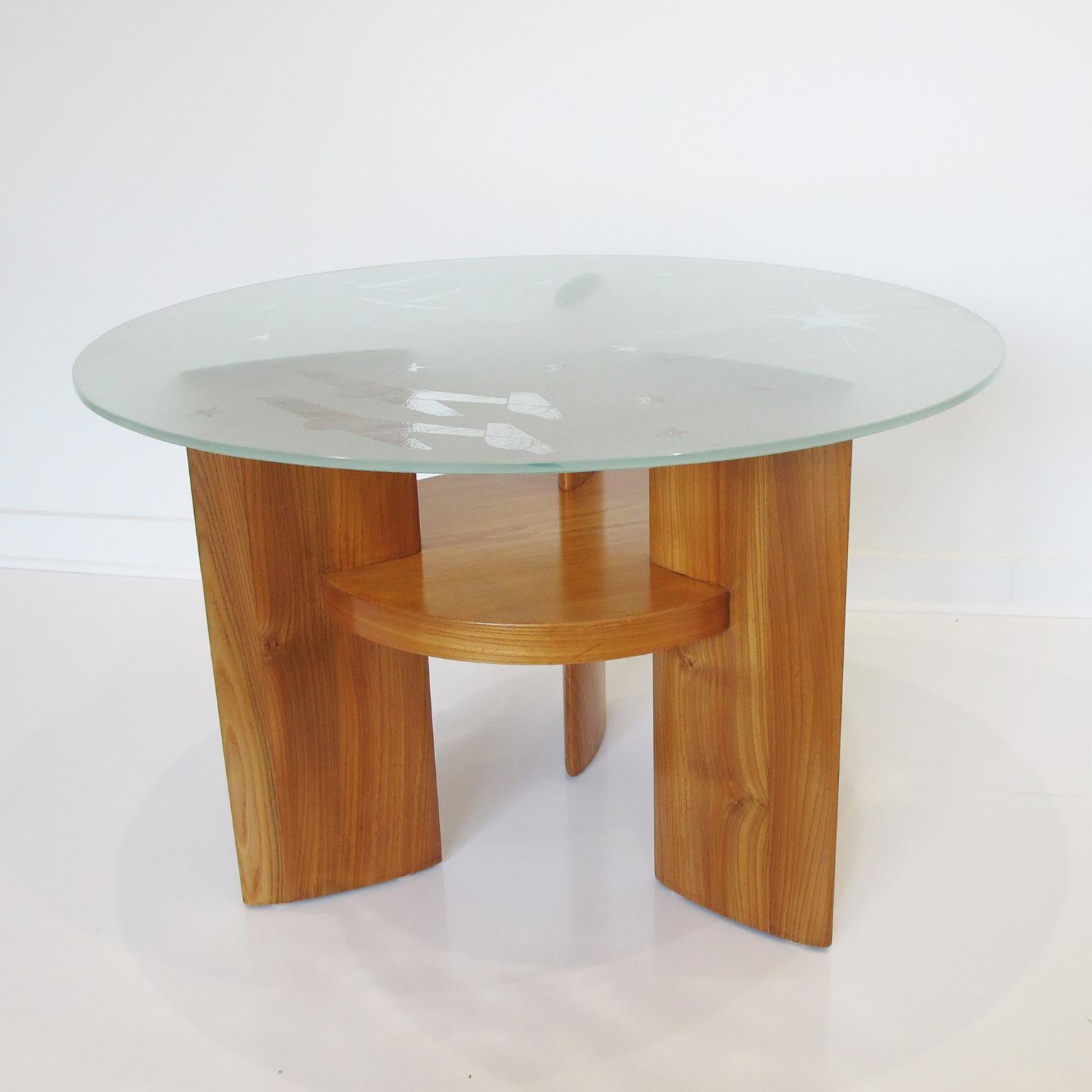 This spectacular Saint Gobain France Art Deco coffee table is a functional and handsome piece for any home. Crafted out of blond walnut, the two-tiered round Gueridon features an extra thick round glass table top made by Saint Gobain, France, with