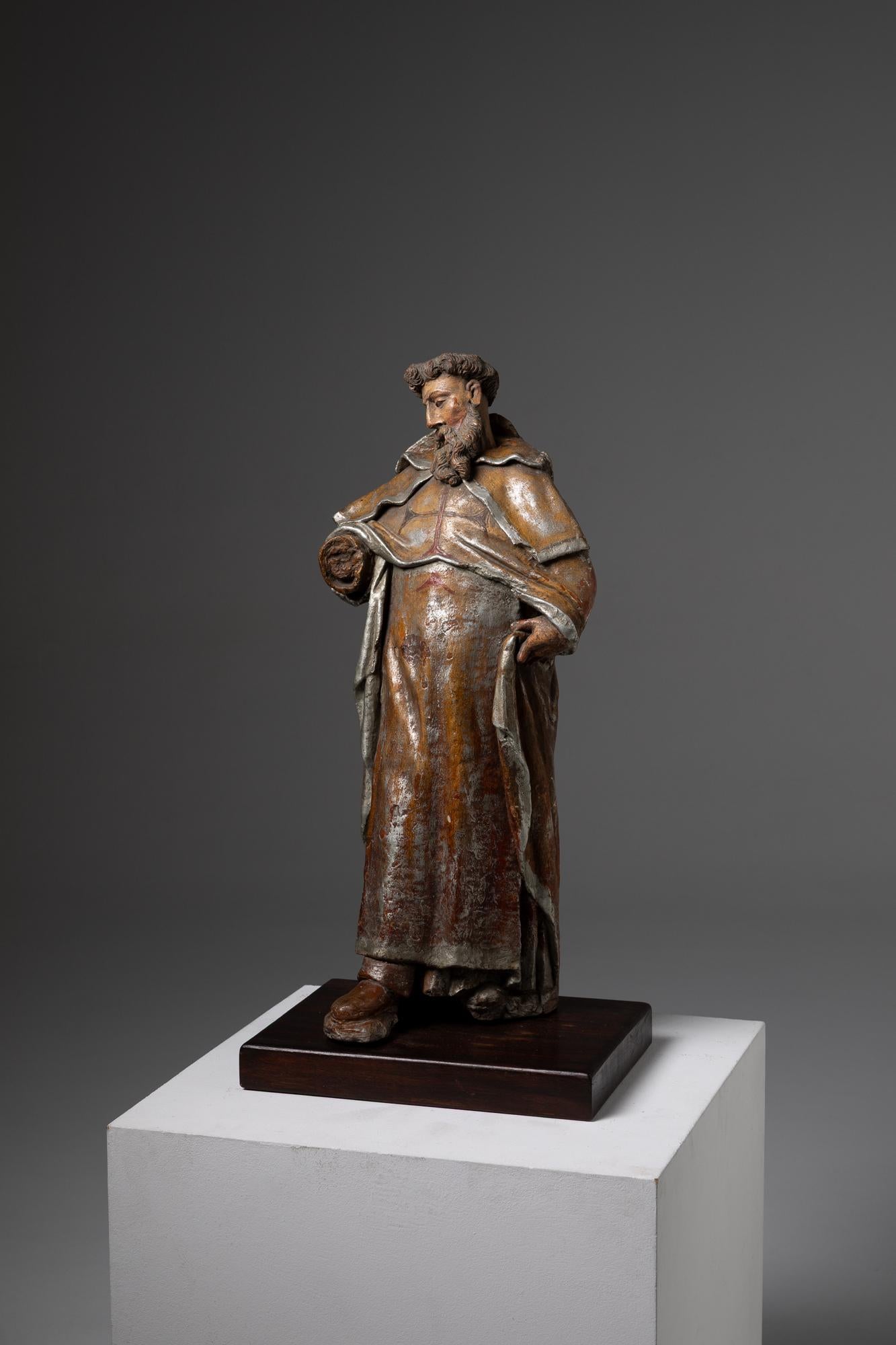 his terracotta sculpture represents Saint John of the Cross, a significant figure in the history of Christian mysticism and reformer of the Carmelite Order. The sculpture is finely crafted in terracotta, polychromed and painted with delicate