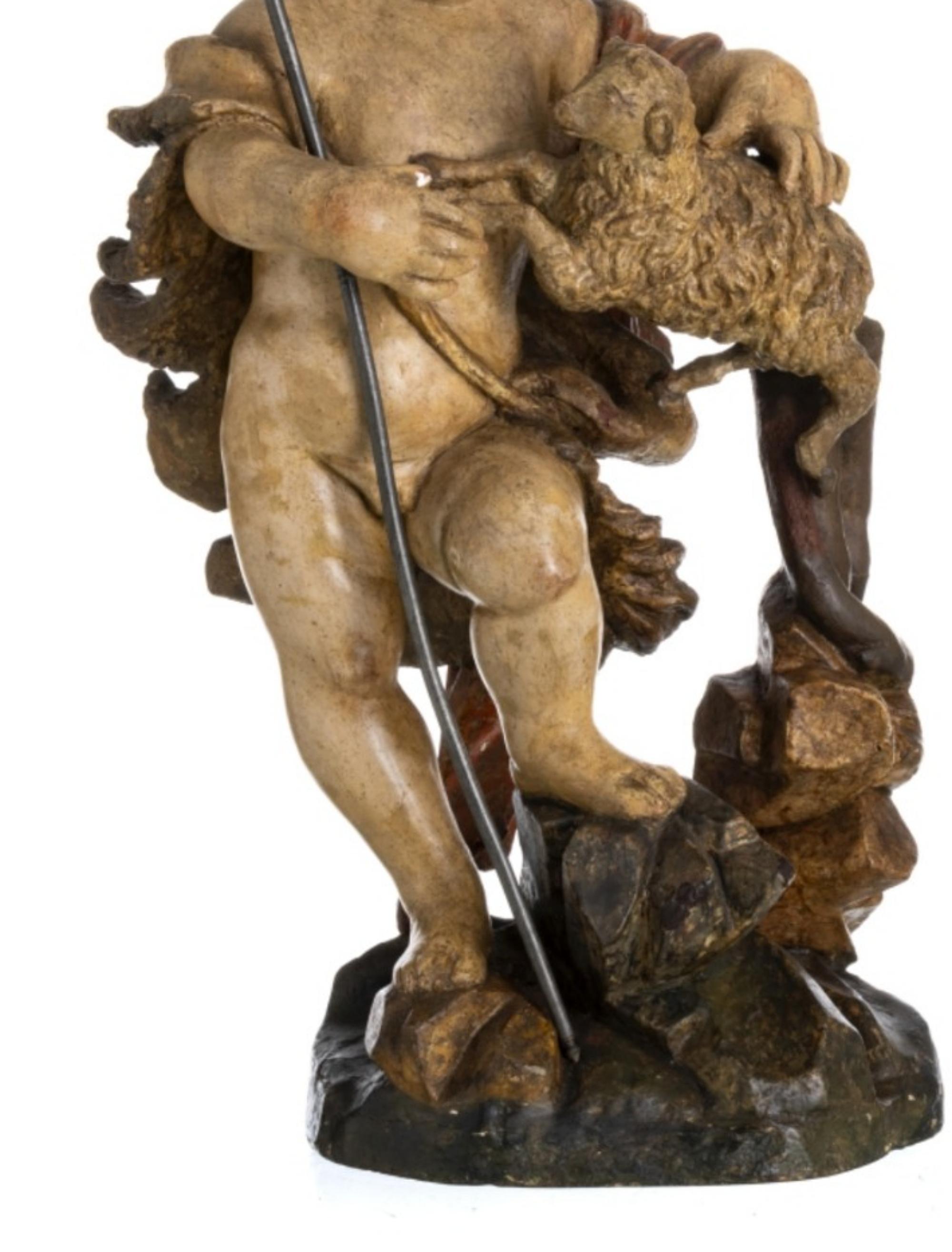 Saint John the Baptist 18th century

Portuguese sculpture from the 18th century. 
in polychrome wood. 
The figure is represented standing with the lamb. 
Small flaws.
Measure: height: 58 cm
Good condition.