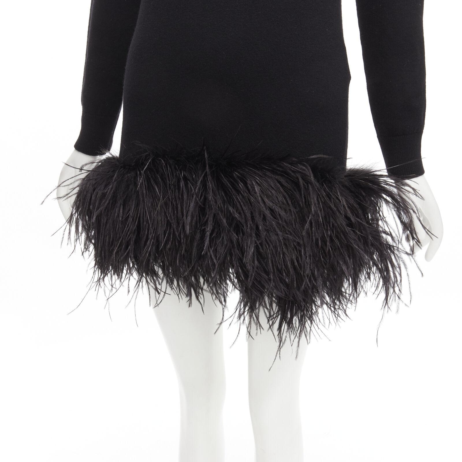 SAINT LAURENT 100% cashmere black ostrich feather trim mini sweater dress XS
Reference: AAWC/A00222
Brand: Saint Laurent
Designer: Anthony Vaccarello
Collection: 2020
Material: 100% Cashmere, Feather
Color: Black
Pattern: Solid
Extra Details: Black