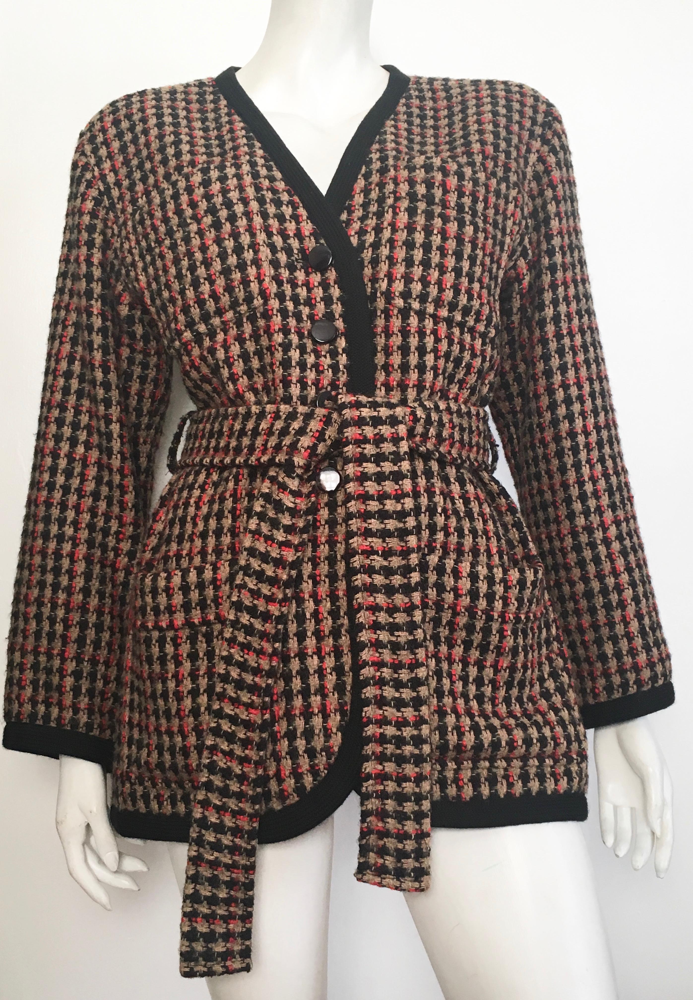 Saint Laurent 1980s wool belted jacket is a French size 38 and fits a size 6.  This ultra stylish belted jacket with pockets is the classic example of the word 'timeless'. Jacket is lined and has mild shoulder pads.  As a stylist I would put this