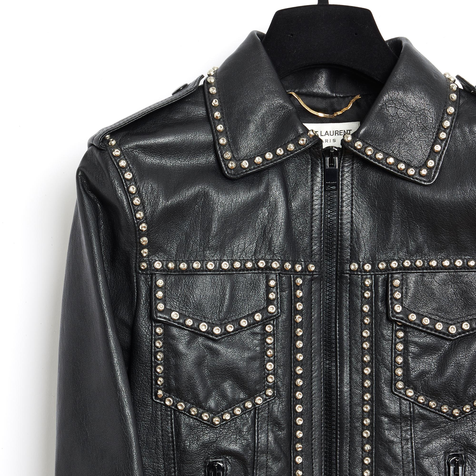Saint Laurent jacket by Hedi Slimane in black leather decorated with silver metal studs all over, small shirt collar, 2 chest pockets with flap, 2 zipped slit pockets, tightening tabs at the back waist, shoulder tabs, long zipped sleeves at the