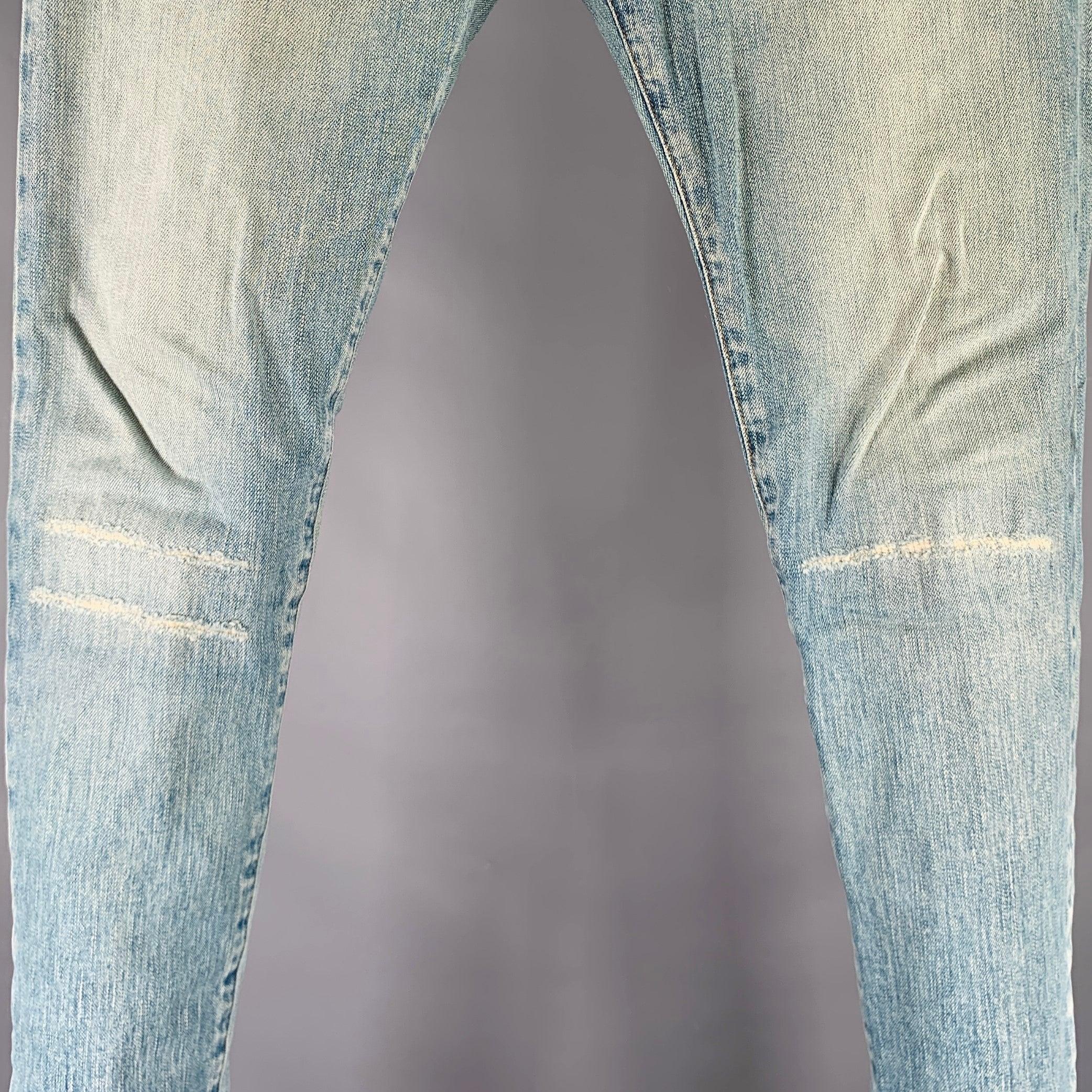 SAINT LAURENT 2016 jeans
in a blue cotton stretch blend fabric featuring a distressed style with 