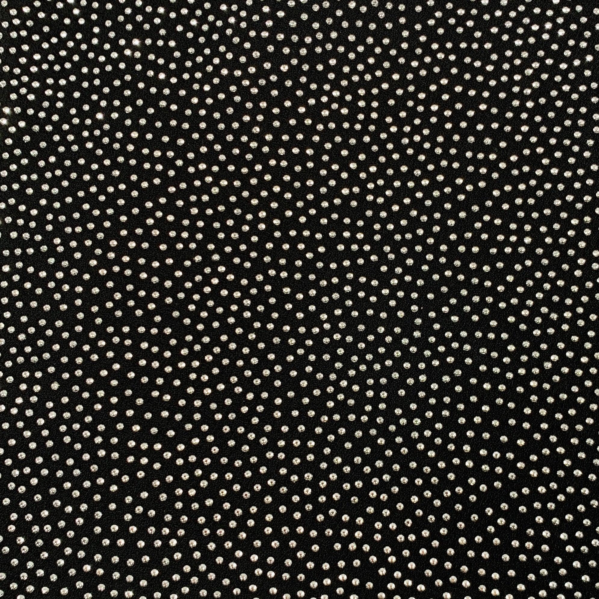 SAINT LAURENT cocktail dress
in a black viscose fabric featuring a silver tone rhinestone studded design, short sleeves, and invisible back zipper closure. Made in France.Excellent Pre-Owned Condition. 

Marked:   FR 36 

Measurements: 
 
Shoulder:
