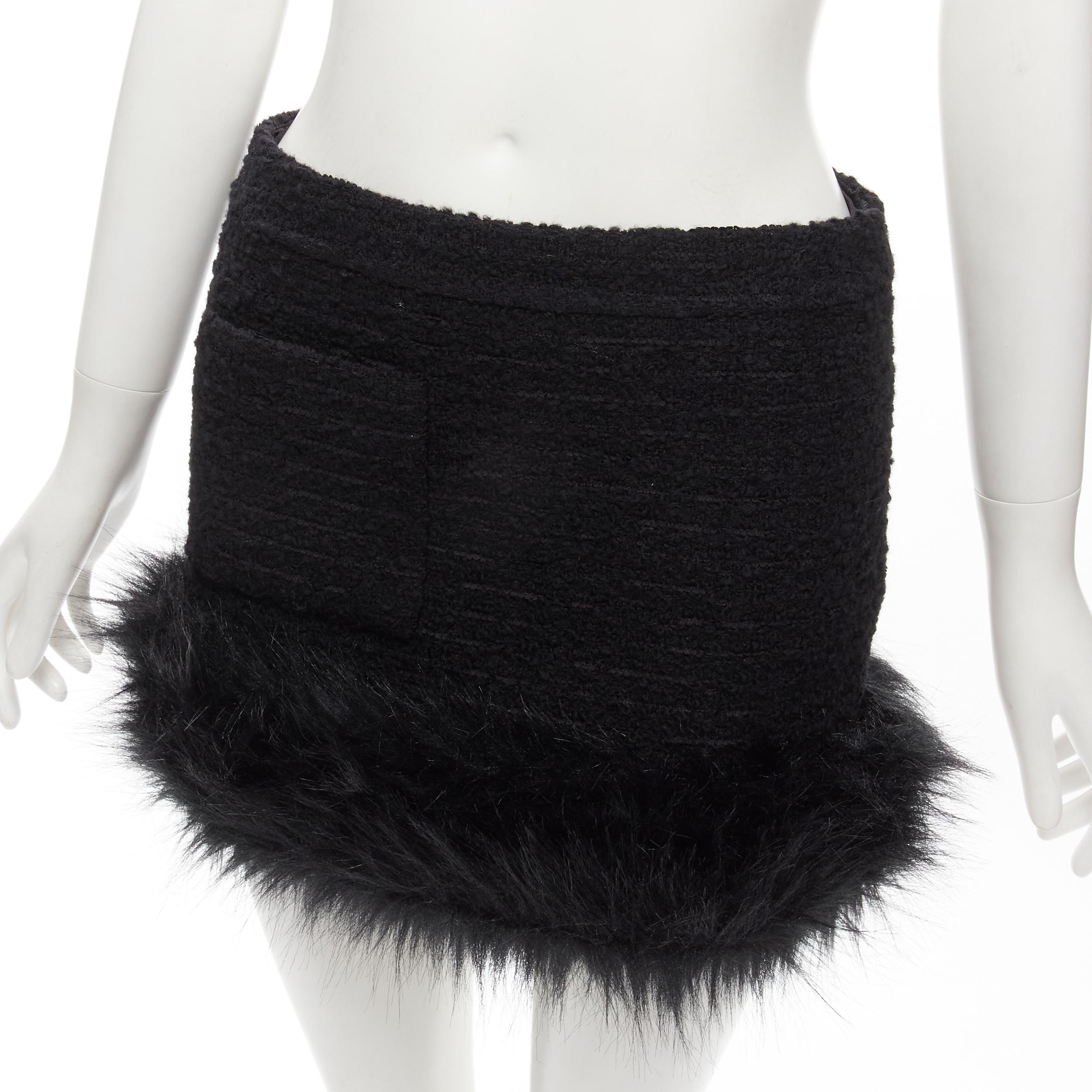 SAINT LAURENT 2022 black tweed faux fur trimmed mini skirt FR34 XS
Brand: Saint Laurent
Designer: Anthony Vaccarello
Collection: 2021 
Material: Tweed
Color: Black
Pattern: Solid
Closure: Zip
Extra Detail: Black tweed. Single patch pocket. Faux fur