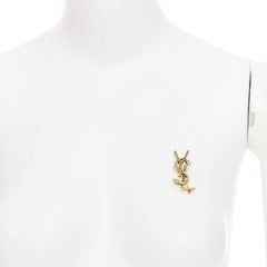 SAINT LAURENT 2022 Cassandre Opyum Snake YSL: spilla in metallo con texture color oro invecchiato