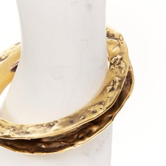 SAINT LAURENT 2023 „Tornato Crater“ – Armreif in Antik-Optik, gehämmert, mit Ausschnitten und hohlem Profil