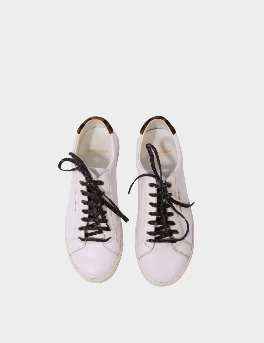Elevate your casual footwear with these Saint Laurent white leather sneakers, blending timeless minimalism with a bold twist. Crafted from smooth premium leather, these low-top sneakers feature clean, sleek lines and subtle Saint Laurent gold logo