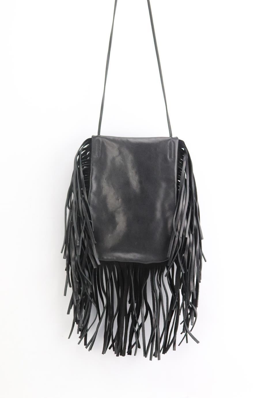 Saint Laurent Anita fringed leather shoulder bag. Made from black leather with silver-tone studded detail and leather fringing, it has a large interior compartment. Black. Flap fastening at front. Does not come with dustbag or box. Height: 9 in.