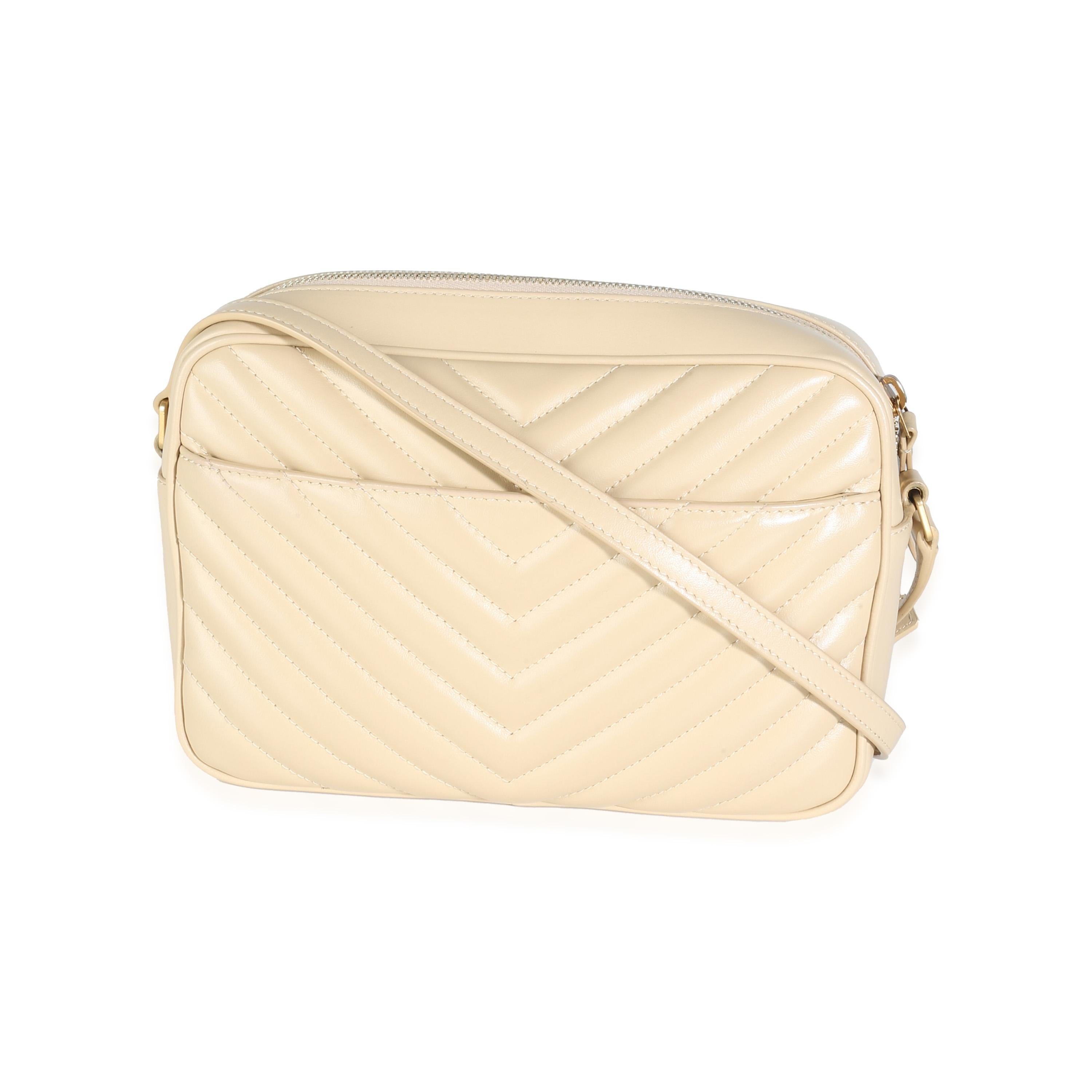 Listing Title: Saint Laurent Avorio Calfskin Matelasse Lou Camera Bag
SKU: 142917
MSRP: 1690.00 USD
Condition: Pre-owned 
Condition Description: Named after Loulou de la Falaise, the Loulou bag from Saint Laurent is an ode to one of the founder's