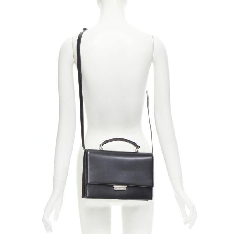 SAINT LAURENT Babylone black smooth leather top handle  flap crossbody bag
Reference: MAWG/A00065
Brand: Saint Laurent
Designer: Anthony Vaccarello
Model: Babylone
Material: Leather
Color: Black
Pattern: Solid
Closure: Push Clasp
Lining: 