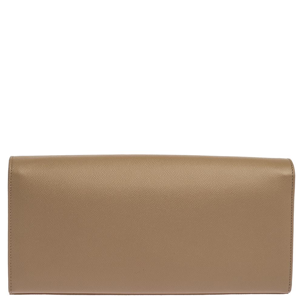 This clutch from the house of Saint Laurent is crafted in a beige shade. This clutch in patent leather has a YSL logo in gold-tone on the front and a well-designed interior meant to hold your essentials with ease.

Includes:Original Dustbag, Info