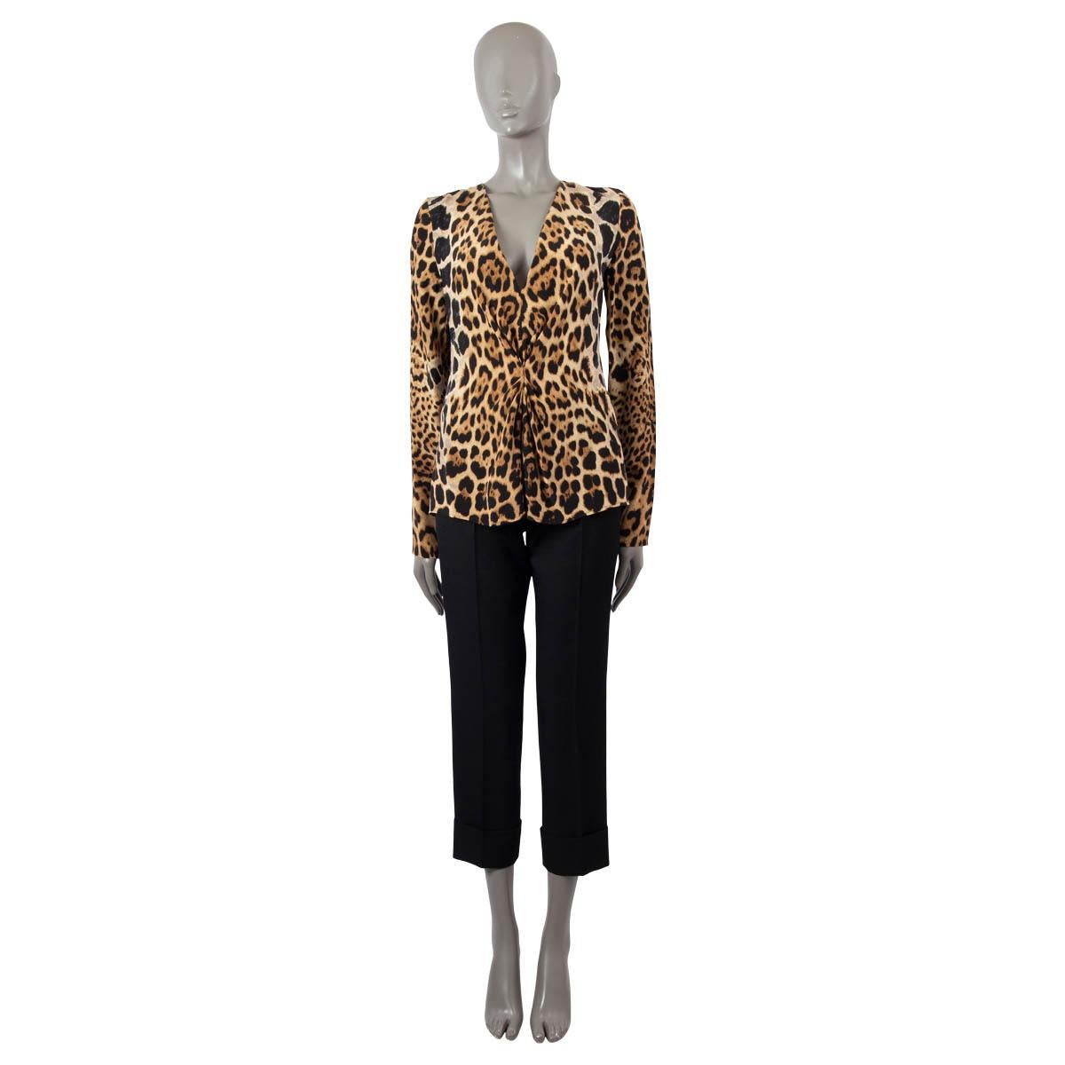 100% authentic Saint Laurent blouse in beige silk (100%) with leopard print. Features a pleated detail at the front and deep V-neck. Closes with a concealed zipper in the back. Unlined. Has been worn and is in excellent condition.

Measurements
Tag
