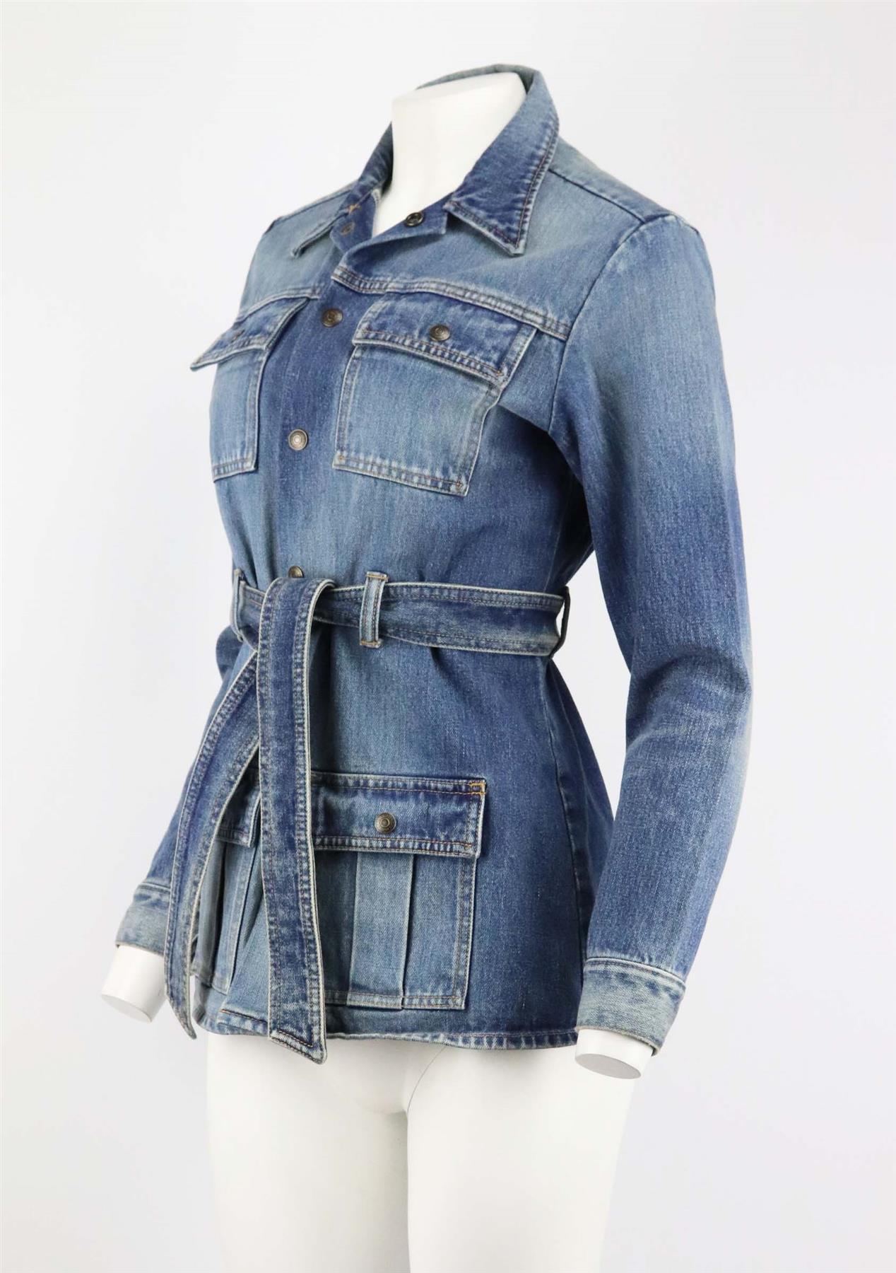 This jacket by Saint Laurent is made from soft blue denim and elevated with a belt that can be left open or knotted at the front to define your waist. Blue denim. Button and tie fastening at front. 100% Cotton. Size: Medium (UK 10, US 6, FR 38, IT