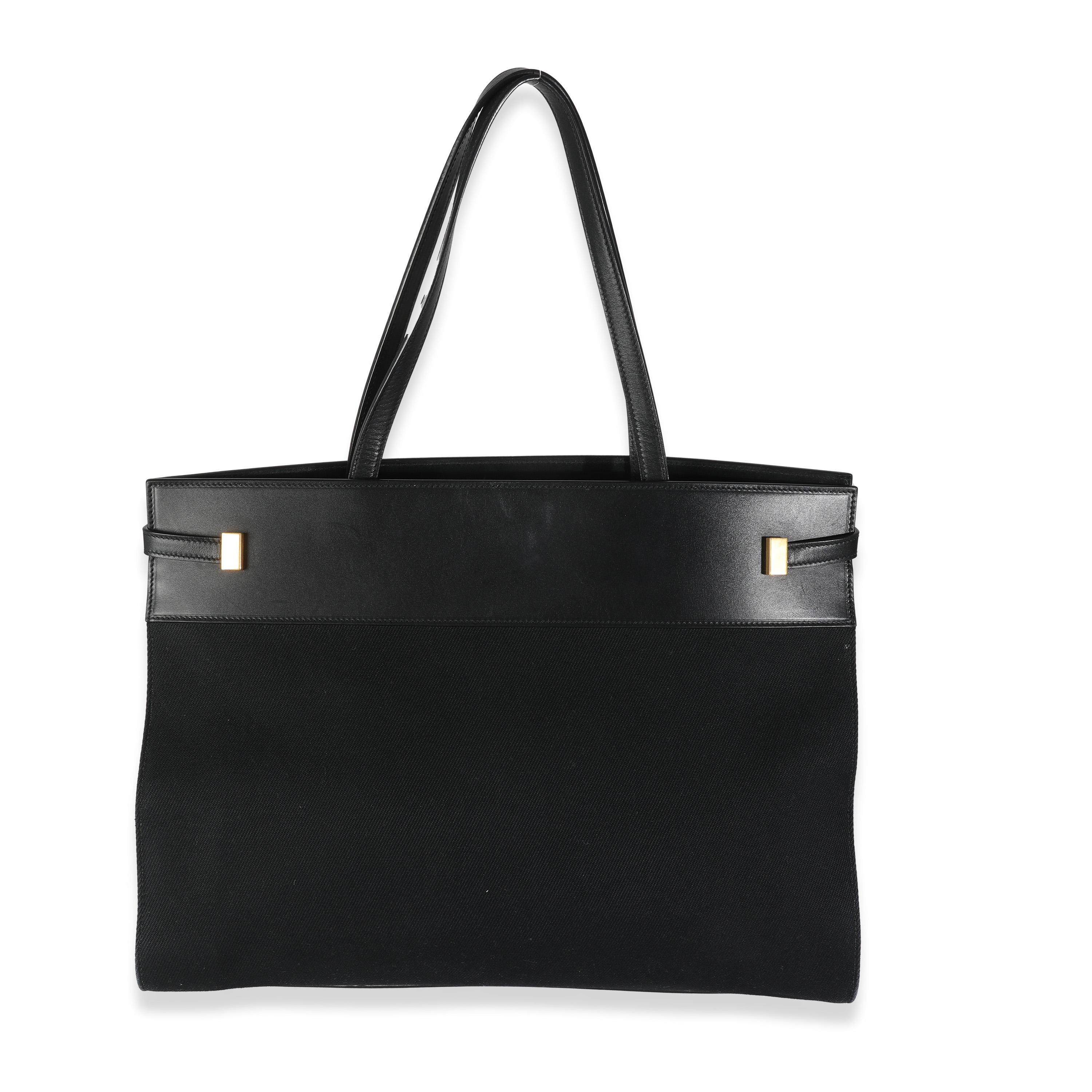 Listing Title: Saint Laurent Black Canvas Manhattan Tote
SKU: 144517
Condition: Pre-owned 
Handbag Condition: Very Good
Condition Comments: Item is in very good condition with minor signs of wear.  Scuffing, scratches, and wear along exterior.