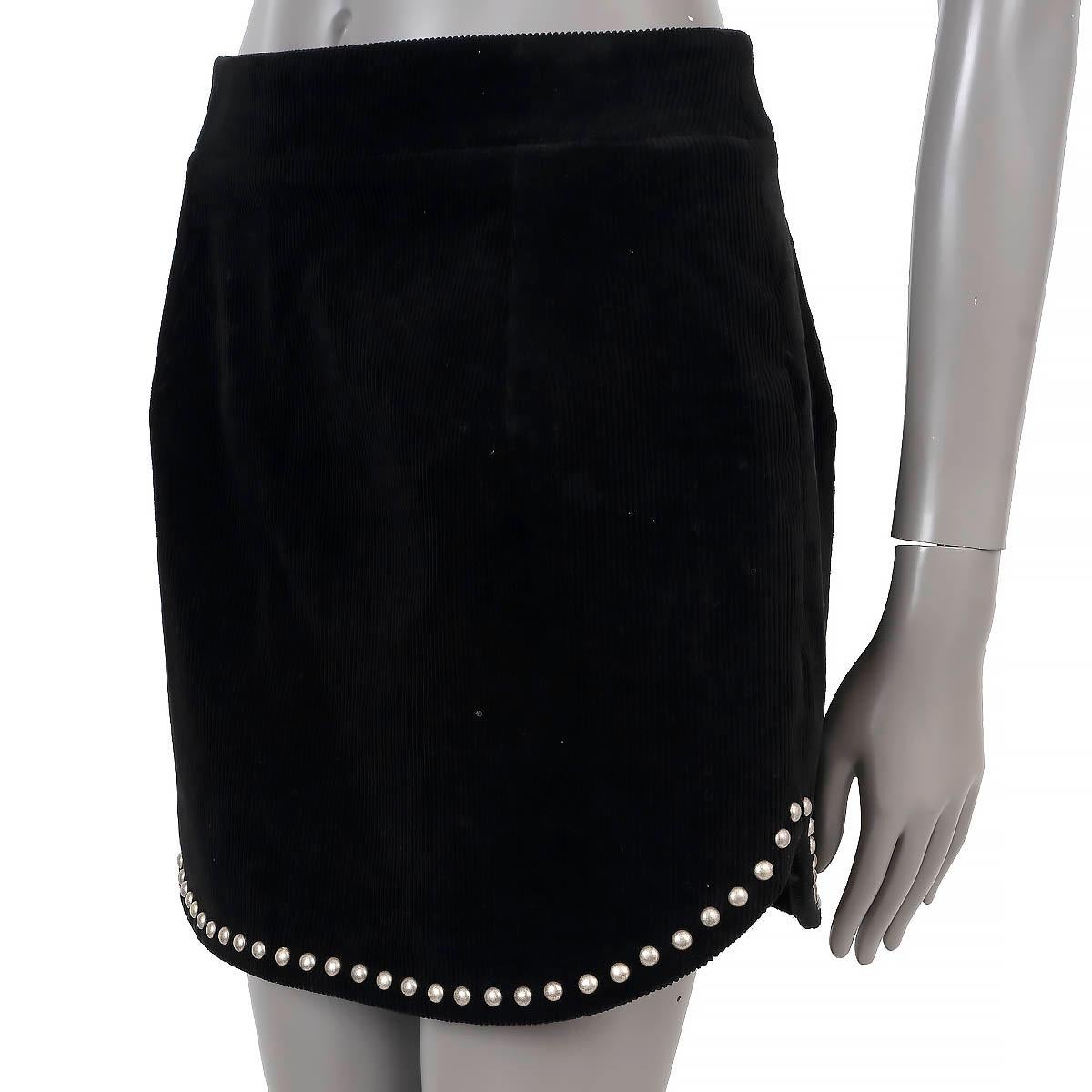 100% authentic Saint Laurent studded skirt in black cotton corduroy (100%) and nylon (4%). Features silver studded at the hem and two pocket on the side. Closes with one hooks and invisible zipper on the back. Lined in black silk (100%). Has been