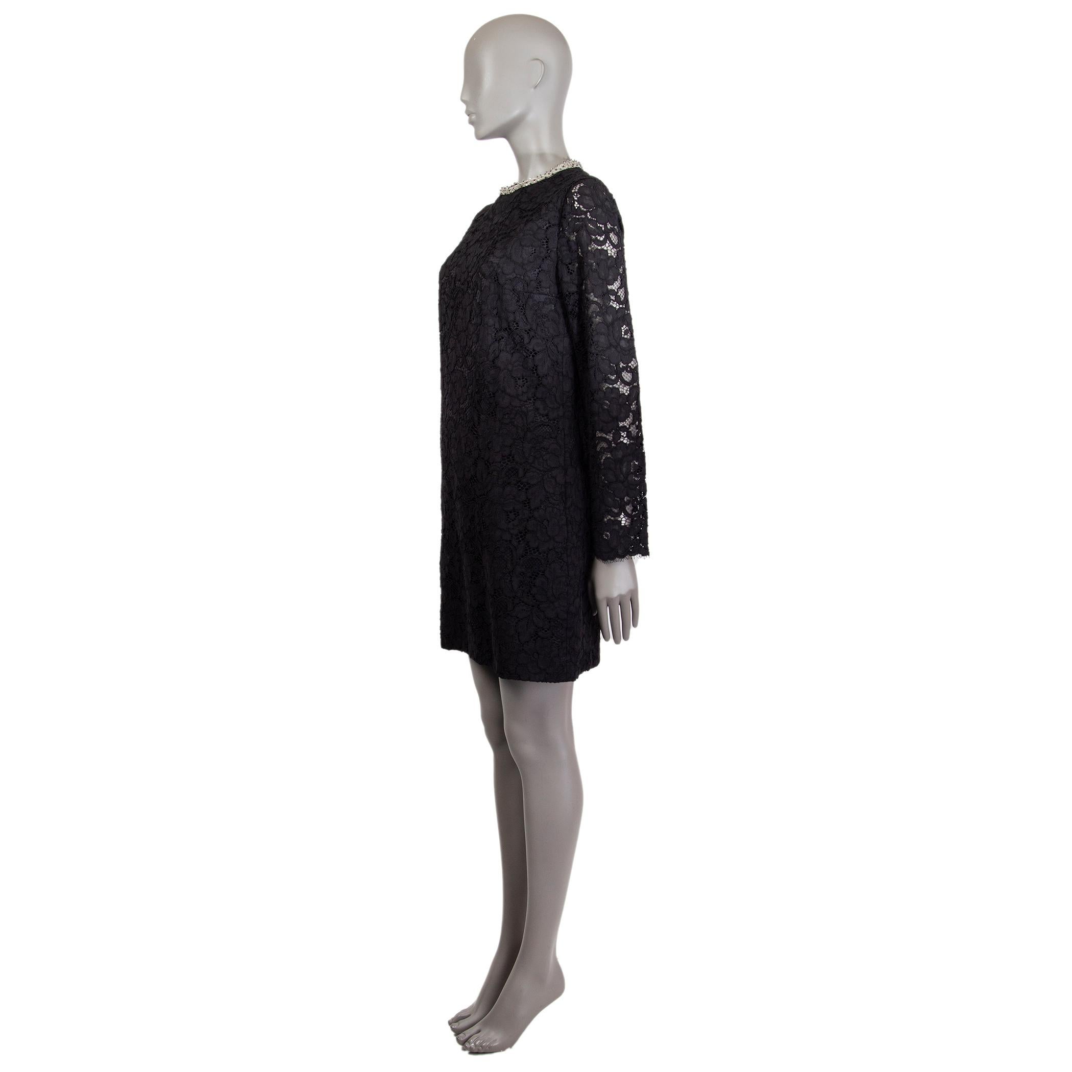 Saint Laurent long-sleeve lace dress in black cotton (44%), nylon (23%), viscose (17%), and modal (16%). With beaded crew neck. Closes with invisible zipper on the back. Lined in black silk (100%). Has been worn and is in excellent condition. 

Tag