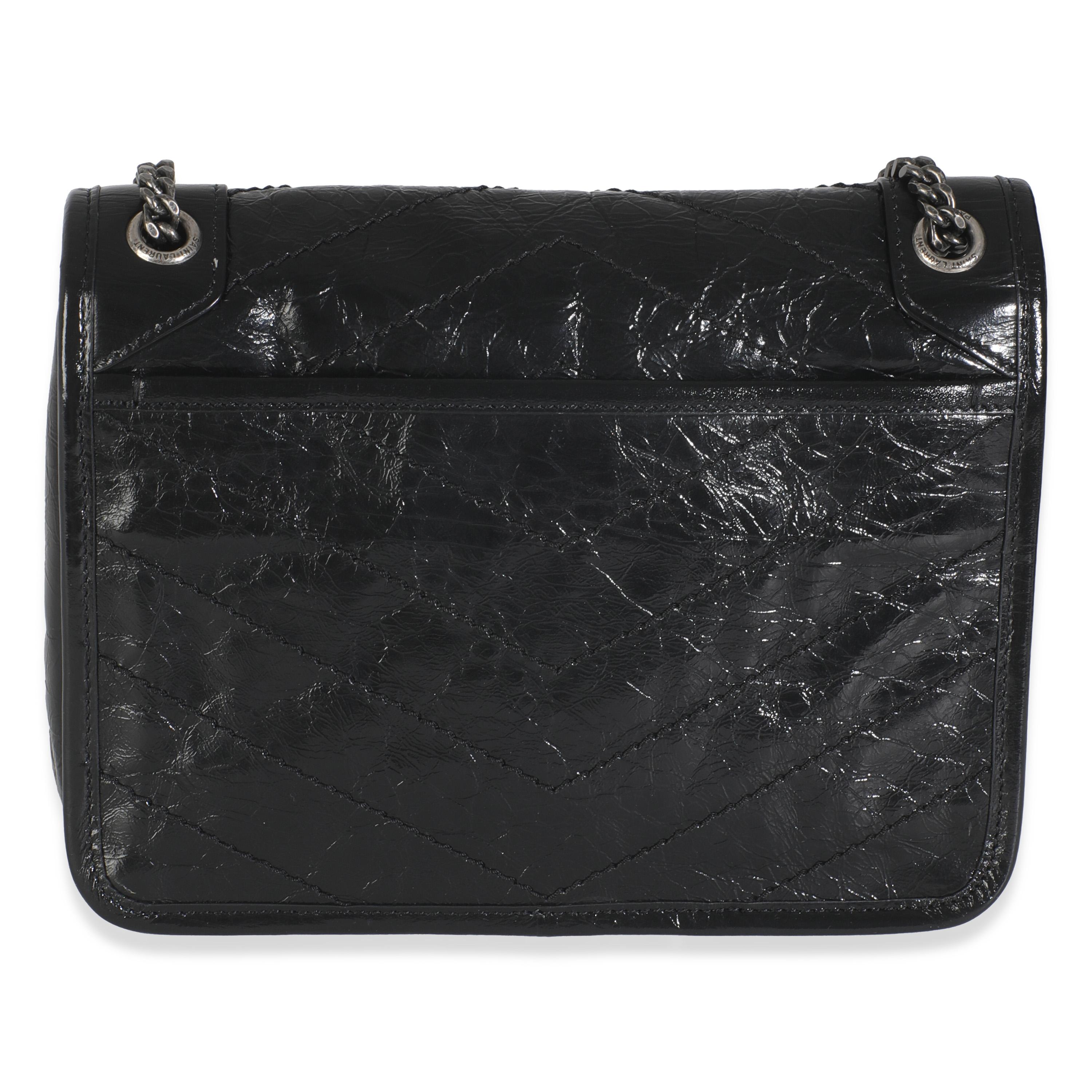 Listing Title: Saint Laurent Black Crinkled Calfskin Matelasse Baby Niki Chain Satchel
SKU: 146092
Condition: Pre-owned 
Handbag Condition: Excellent
Condition Comments: Item is in excellent condition and displays light signs of wear. Scratching