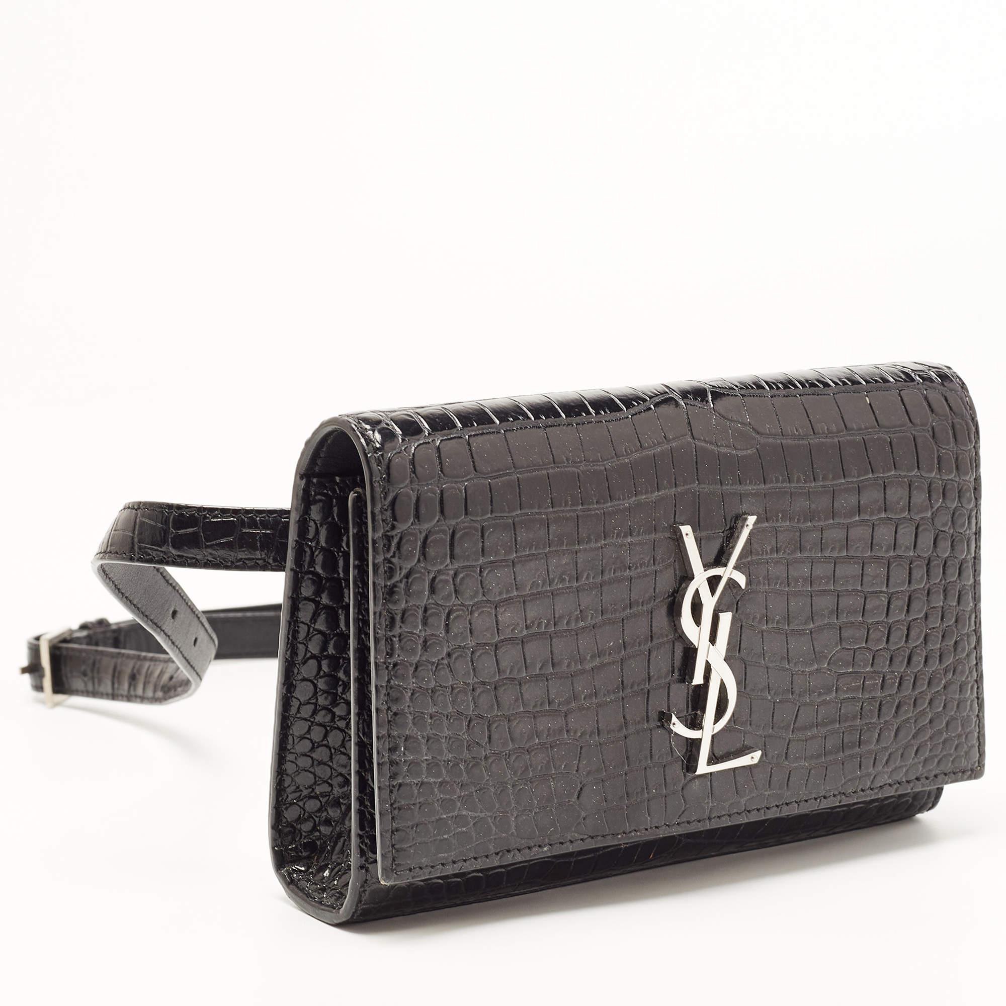 This uber-stylish Saint Laurent waist belt bag aims to be an elevating piece. It is carefully created using croc-embossed leather and has the YSL logo on the front. See how it transforms a T-shirt dress or a solid jumpsuit!

