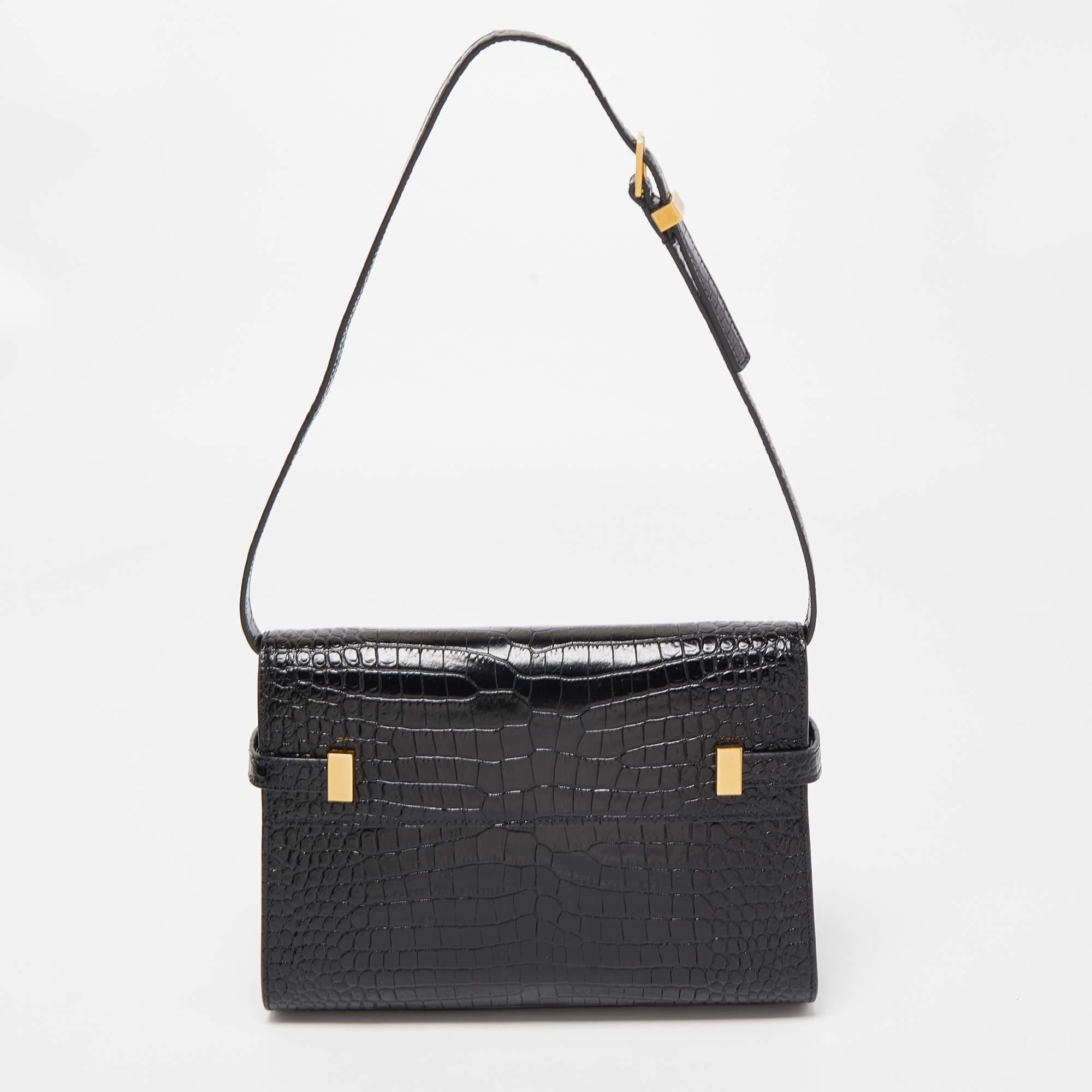 Structured, sophisticated, and stylish are some words that describe this Saint Laurent shoulder bag! Crafted from the best quality material, the creation is adorned with the label's signature appeal and equipped with a well-spaced interior. Carry it