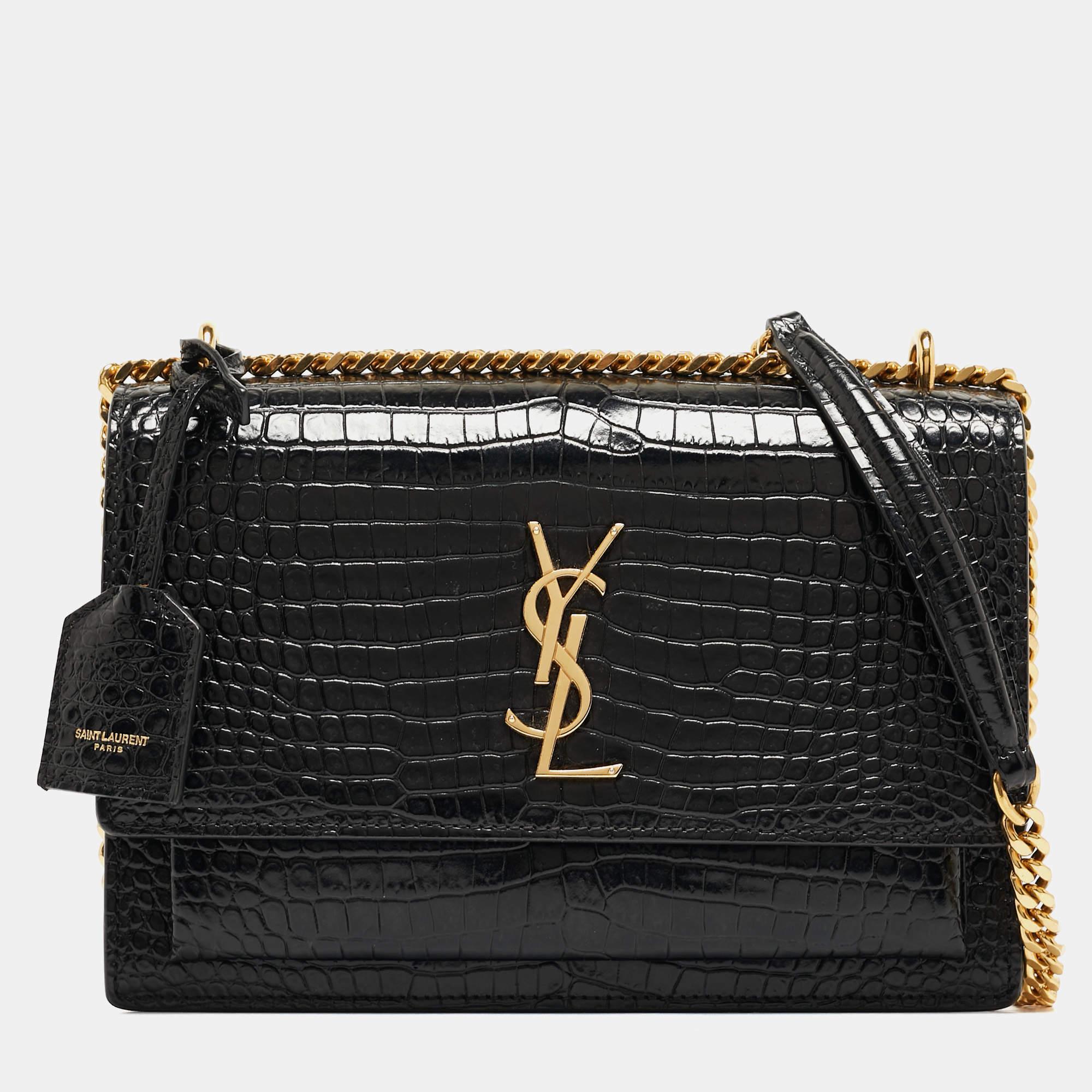 Fall in love with this Sunset bag from Saint Laurent! Crafted from leather, it flaunts the 'YSL' logo on the front flap in gold-tone metal. It has a spacious suede-lined interior that houses pockets. This black beauty is complete with a chain-link
