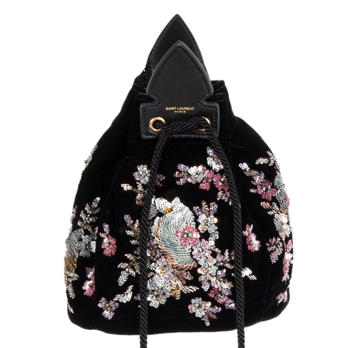 Saint Laurent 'Anja' tassel bucket bag in black velvet embellished with silver, pale pink, orange and salmon flower patern sequins. Lined in black leather. Brand new. Comes with dust bag. 

Height 18cm (7in)
Width 16cm (6.2in)
Depth 16cm