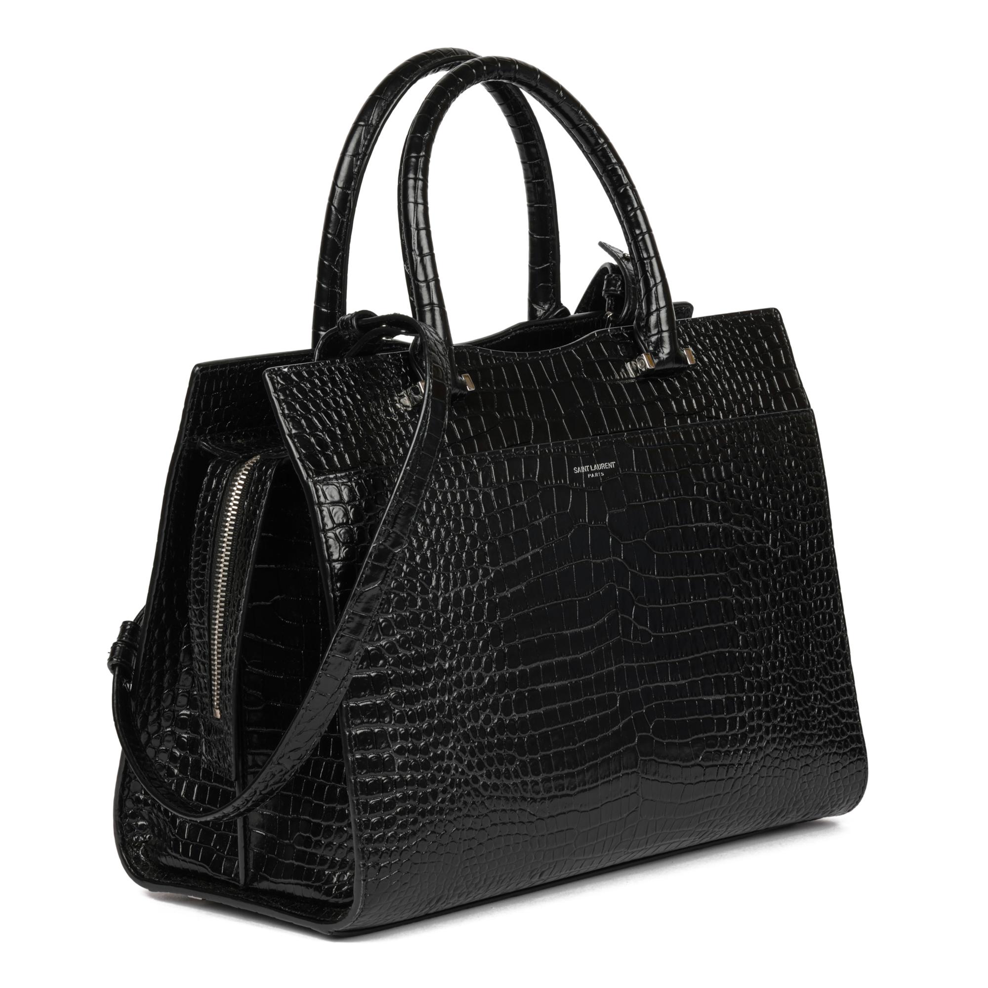 SAINT LAURENT
Black Faux Crocodile-Embossed Leather Small Uptown Bag

Xupes Reference: CB887
Serial Number: MAL557655.0319
Age (Circa): 2019
Accompanied By: Saint Laurent Dust Bag, Care Booklet, Authenticity Card
Authenticity Details: Date Stamp