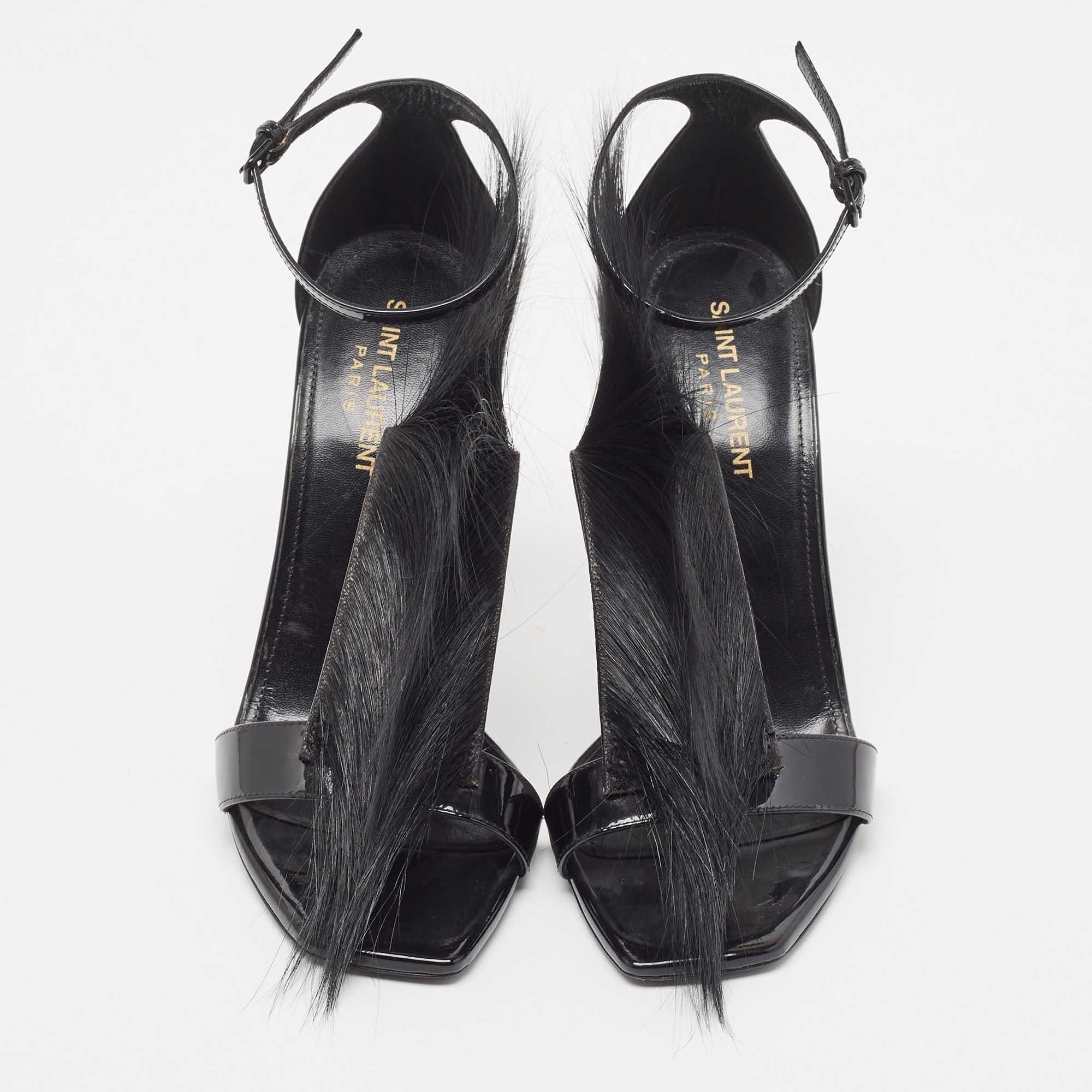 Deliver statement looks with these sandals from Saint Laurent! From their shape and detailing to their overall appeal, they exude elegance. The sandals feature open toes, fur detailing, ankle strap closure, and stiletto heels.

