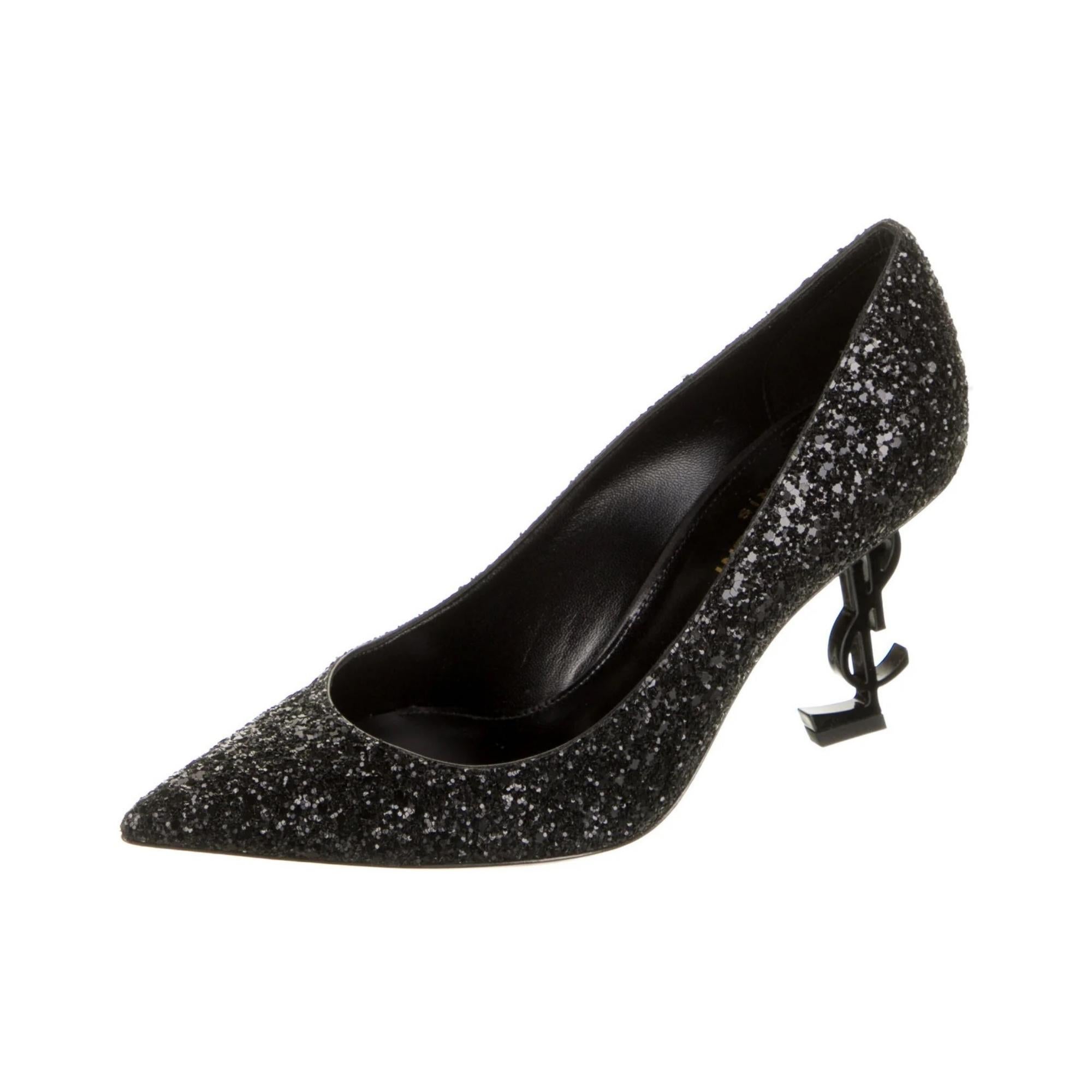 Saint Laurent pumps in black leather with glitter featuring a low cut vamp, pointed toe, leather sole and sculptural interlocking YSL heels of black metallic. This model is set on a 85 mm (3.5 inch) heels.

COLOR: Black
MATERIAL: Leather
ITEM CODE: