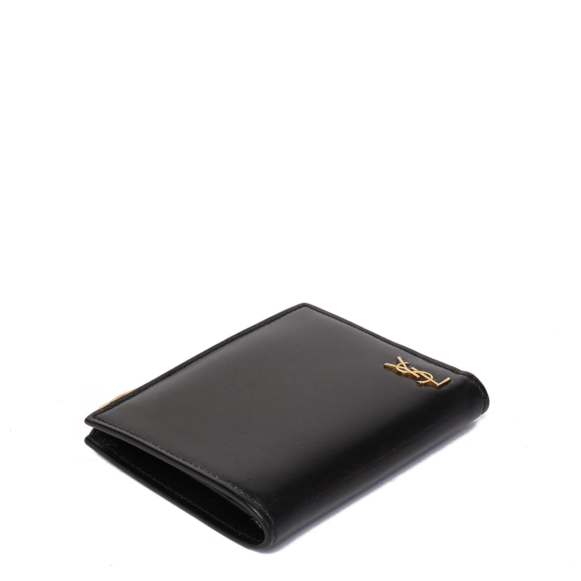 Saint Laurent Black Grained Leather TIny Cassandre Bi-fold ID Wallet

CONDITION NOTES
The exterior is in very good condition with minimal signs of use.
The interior is in very good condition with minimal signs of use.
The hardware is in very good