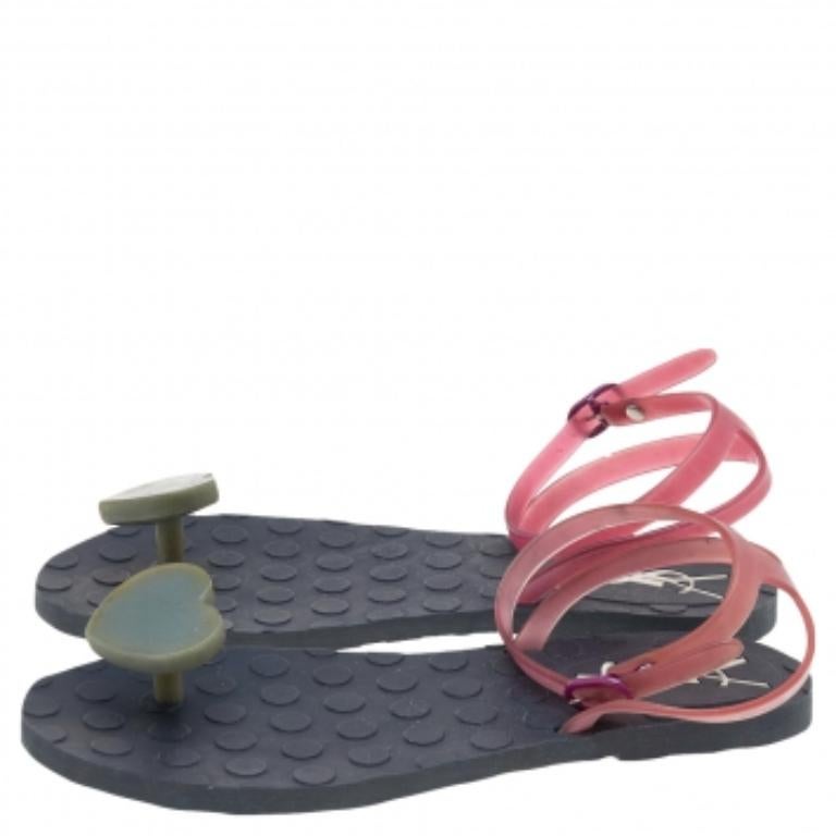 Give an edge to your outfit by stepping out in these thong sandals from the house of Saint Laurent. Crafted from quality jelly, this pair features star-fish embellishments and buckle fastening at the ankle. The pair is complete with rubber soles.