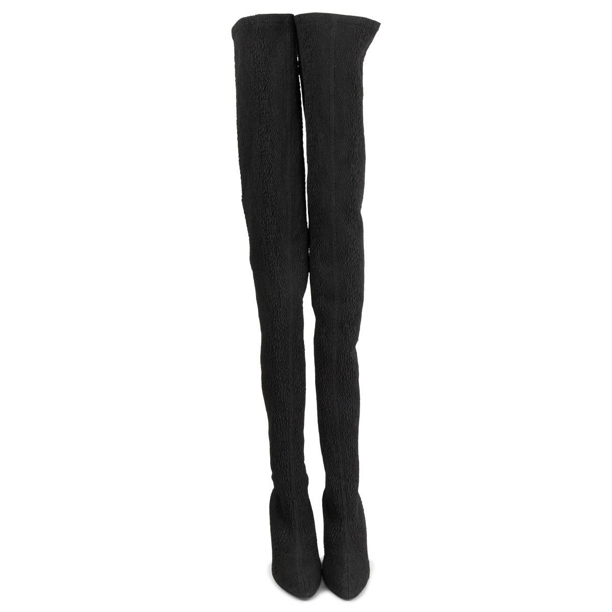 100% authentic Saint Laurent Koller over-the-knee boots are made from black tactile stretch-cloqué that has a sock-like fit through the calves and thighs. They have internal rubberized trims to keep them in place as you walk. Have been worn once