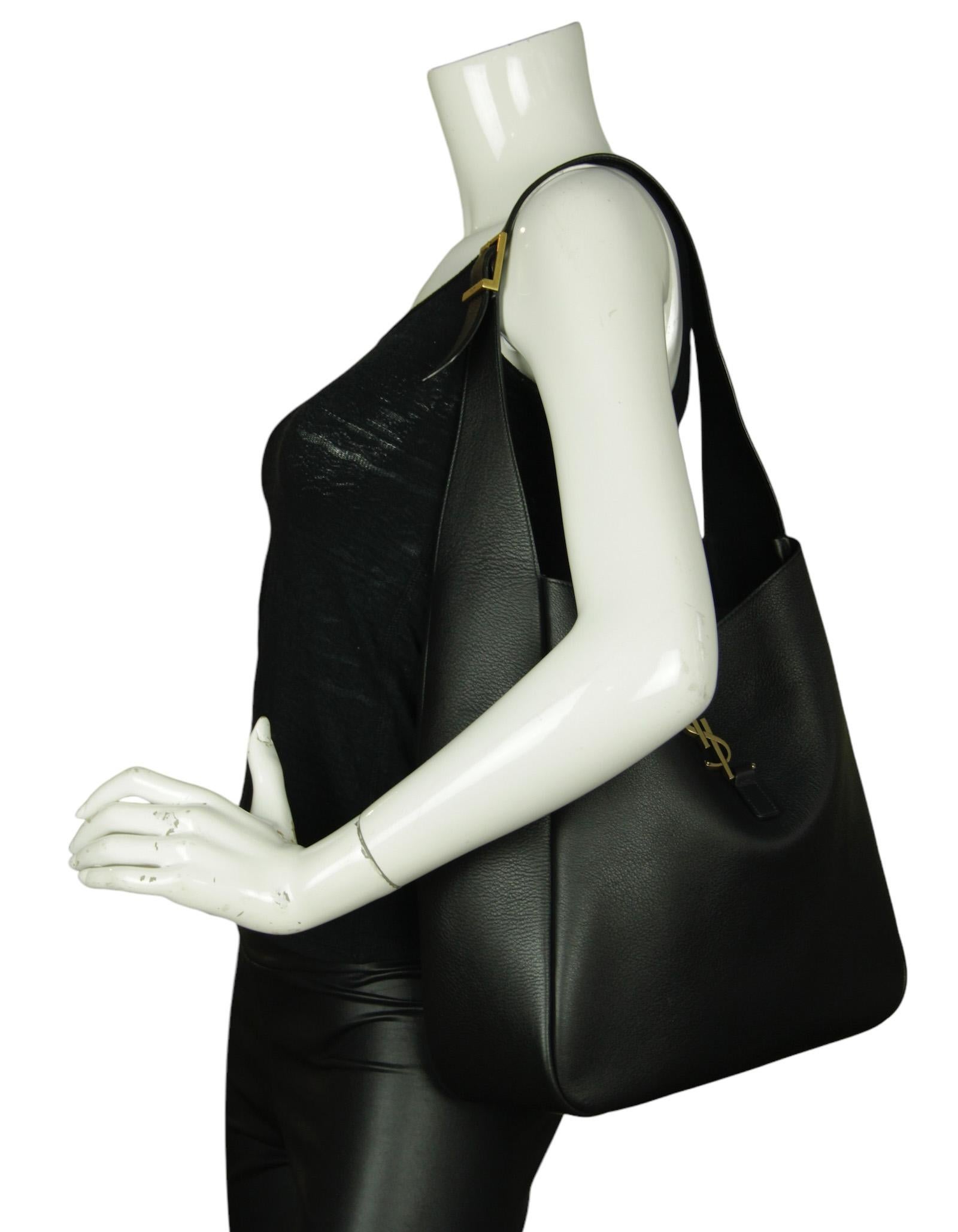 Saint Laurent Black Large Le 5 à 7 Supple Leather Shoulder bag

Made In: Italy
Color: Black
Hardware: Gold
Materials: Calfskin leather, metal
Lining: Black suede 
Closure/Opening: Open with center leather piece
Exterior Pockets: None
Interior