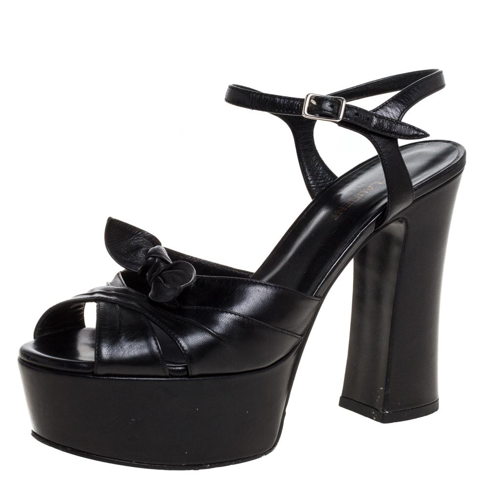 These sandals from Saint Laurent will lift you with ease. Crafted in Italy, they are made from classic black leather and have a lovely silhouette. They feature open toes, Candy bows on the uppers, platforms, buckled ankle straps and 12.5 cm block