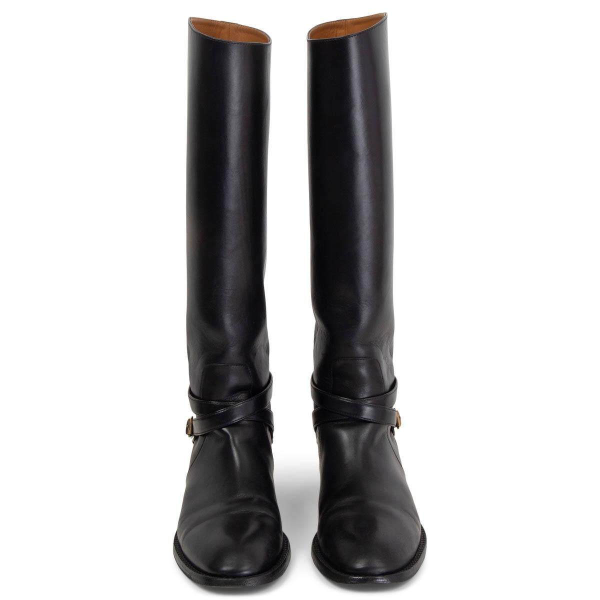100% authentic Saint Laurent Cavaliere Buckled Riding Boots in black calfskin with belted detail around the ankle. Have been worn and need a new sole at front. Overall in excellent condition. Come with dust bag. 

Measurements
Imprinted Size	41
Shoe