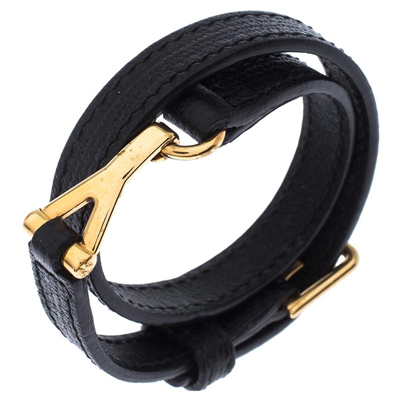 Saint Laurent’s Chyc wrap around bracelet will adorn your wrist and elevate your style. Black leather bracelet has gold-tone hardware, a ‘Y’ shaped insert and buckle closure. Its wrap around style makes it unique and a standout accessory! Wear it to