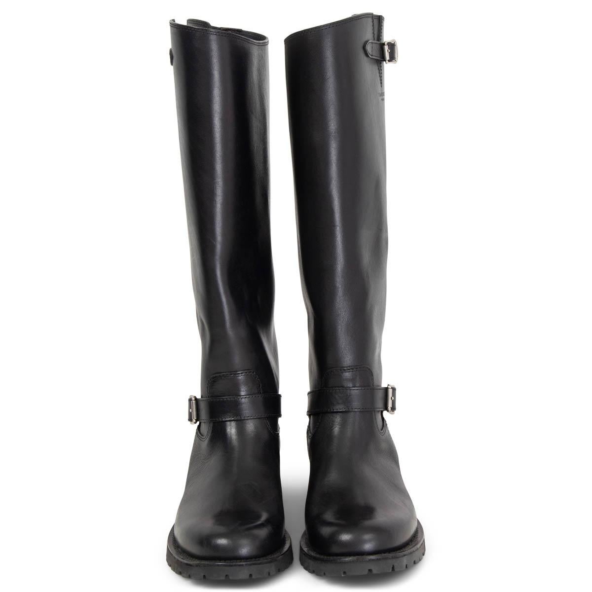 100% authentic Saint Laurent knee-high classic biker boots in black calfskin with two decorative buckles and a black rubber sole. Have been worn once or twice and are in virtually new condition. 

Measurements
Imprinted Size	39
Shoe Size	39
Inside