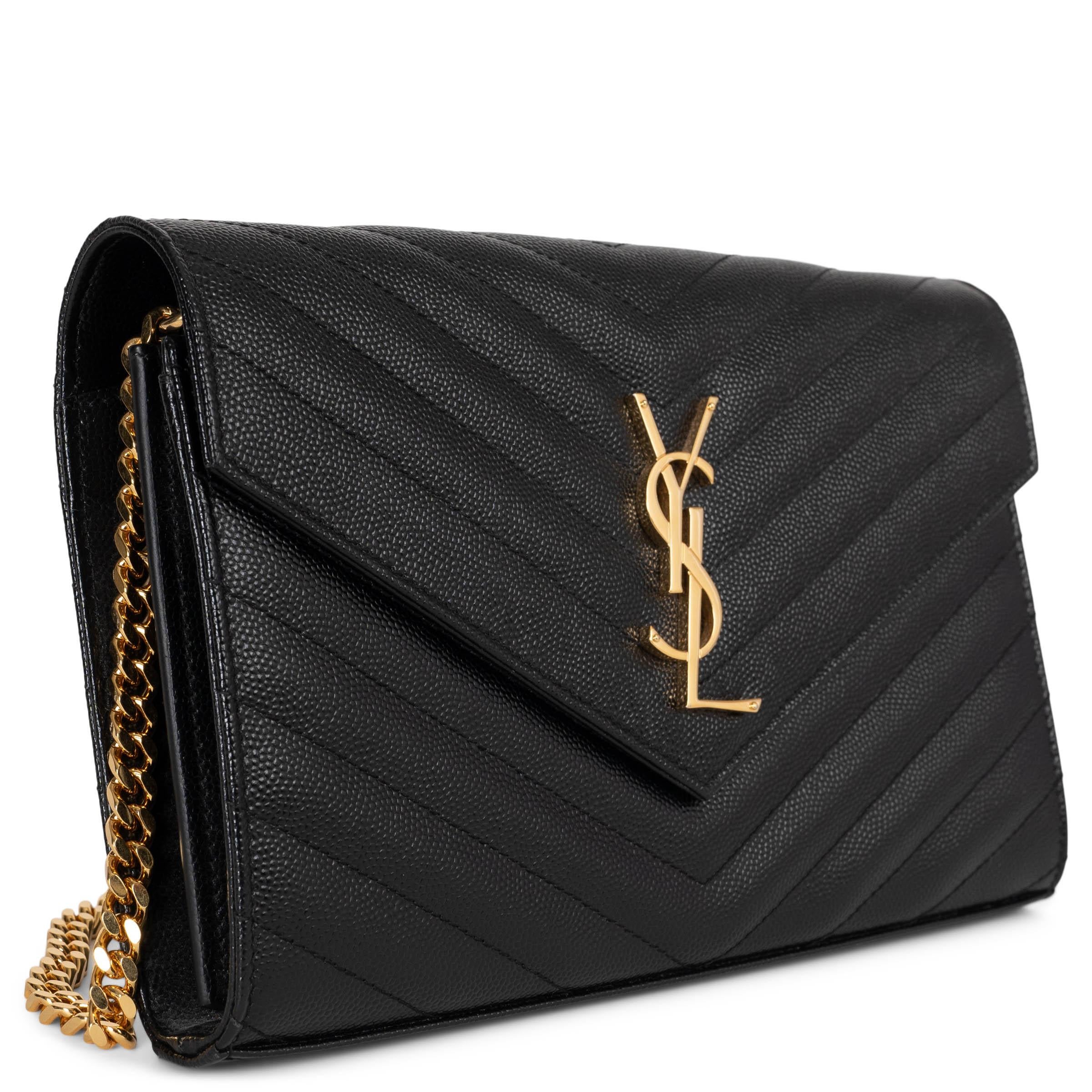 This 100% authentic Saint Laurent Cassandre Chain Wallet in black chevron-quilted Grain de Poudre leather is a timeless statement of elegance. Accented with a gold-tone YSL monogram, it features a detachable chain strap for versatile wear. The