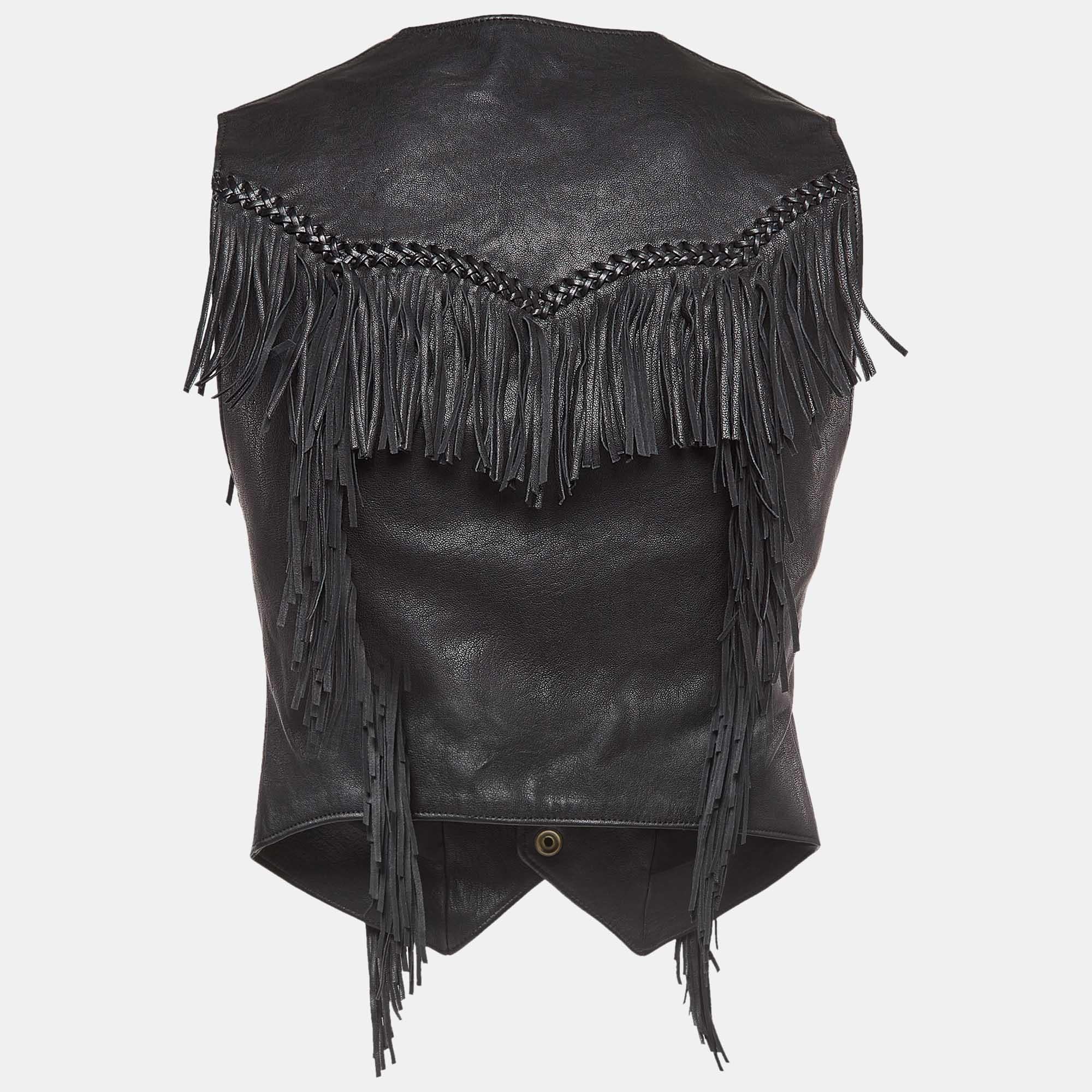 Crafted by Saint Laurent, this striking black leather vest exudes a fusion of rugged charm and urban chic. Adorned with intricate fringe detailing, it channels a rebellious spirit with a touch of refinement. Perfect for adding a dash of edgy