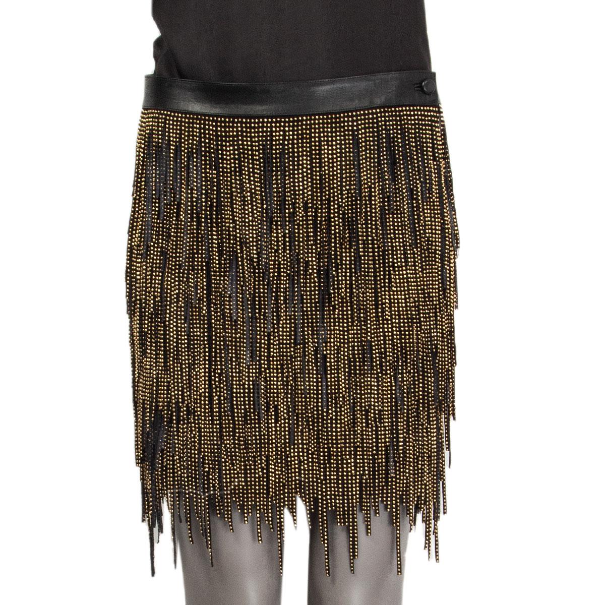 authentic Saint Laurent fringe skirt in black lambskin (100%) with small golden heavy beads. Closes with one button and a zipper on the side. Lined in black silk (100%). Has been worn and is in excellent condition.

Tag Size 36
Size XS
Waist 80cm