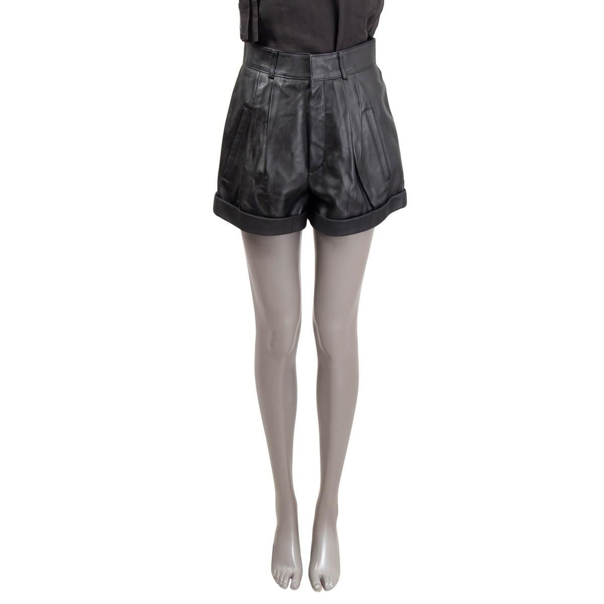 100% authentic Saint Laurent high waisted shorts in black leather (100%). Feature belt loops, two slit pockets. Open with push-button and a zipper on the front. Lined in silk (100%). Has been worn and is in excellent condition.

Measurements
Tag