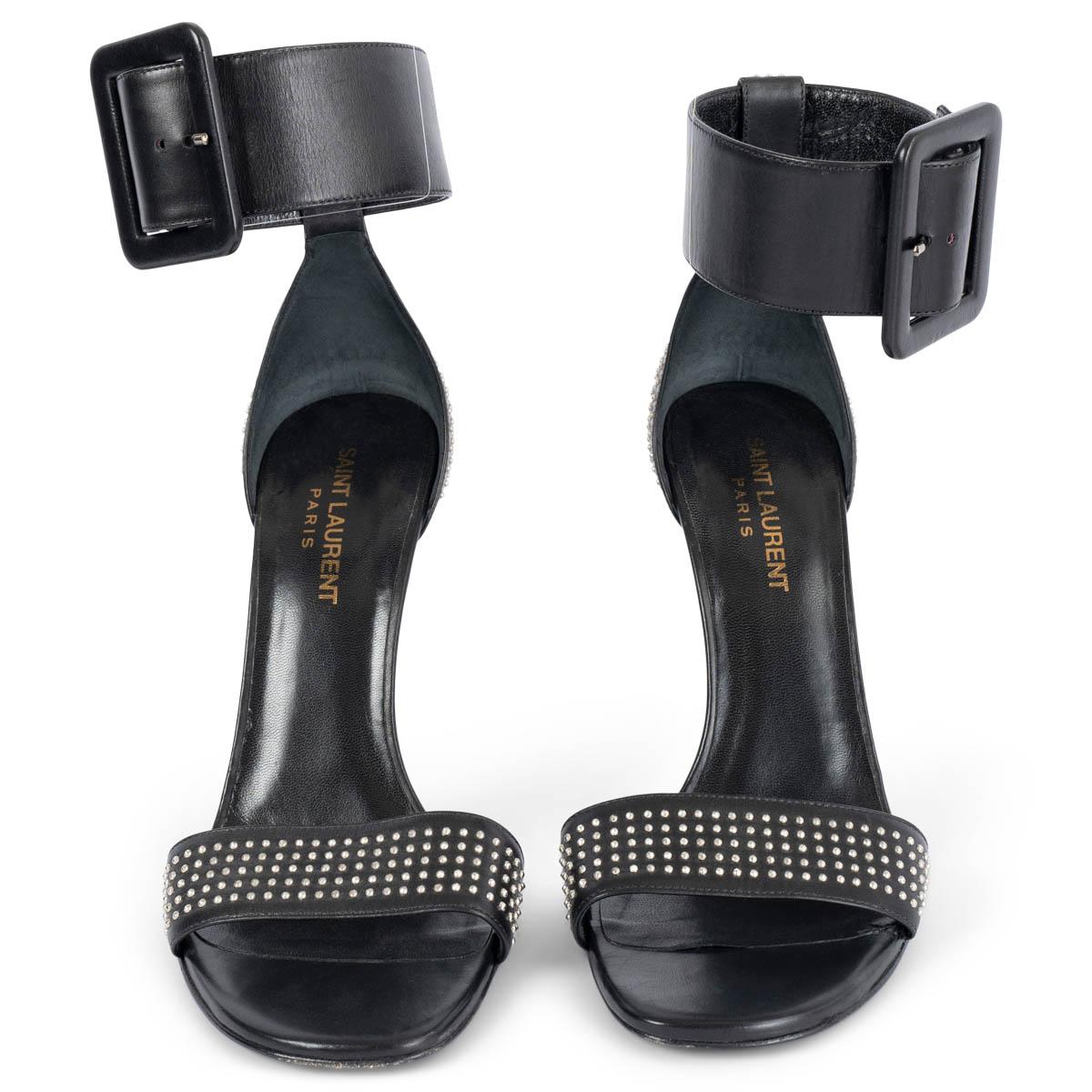 100% authentic Saint Laurent Jane 106 sandals in black calfskin with silver studded design throughout and a chunky ankle strap with adjustable buckle closure. Open toe and stiletto heels. Have been worn once or twice and are in excellent condition.